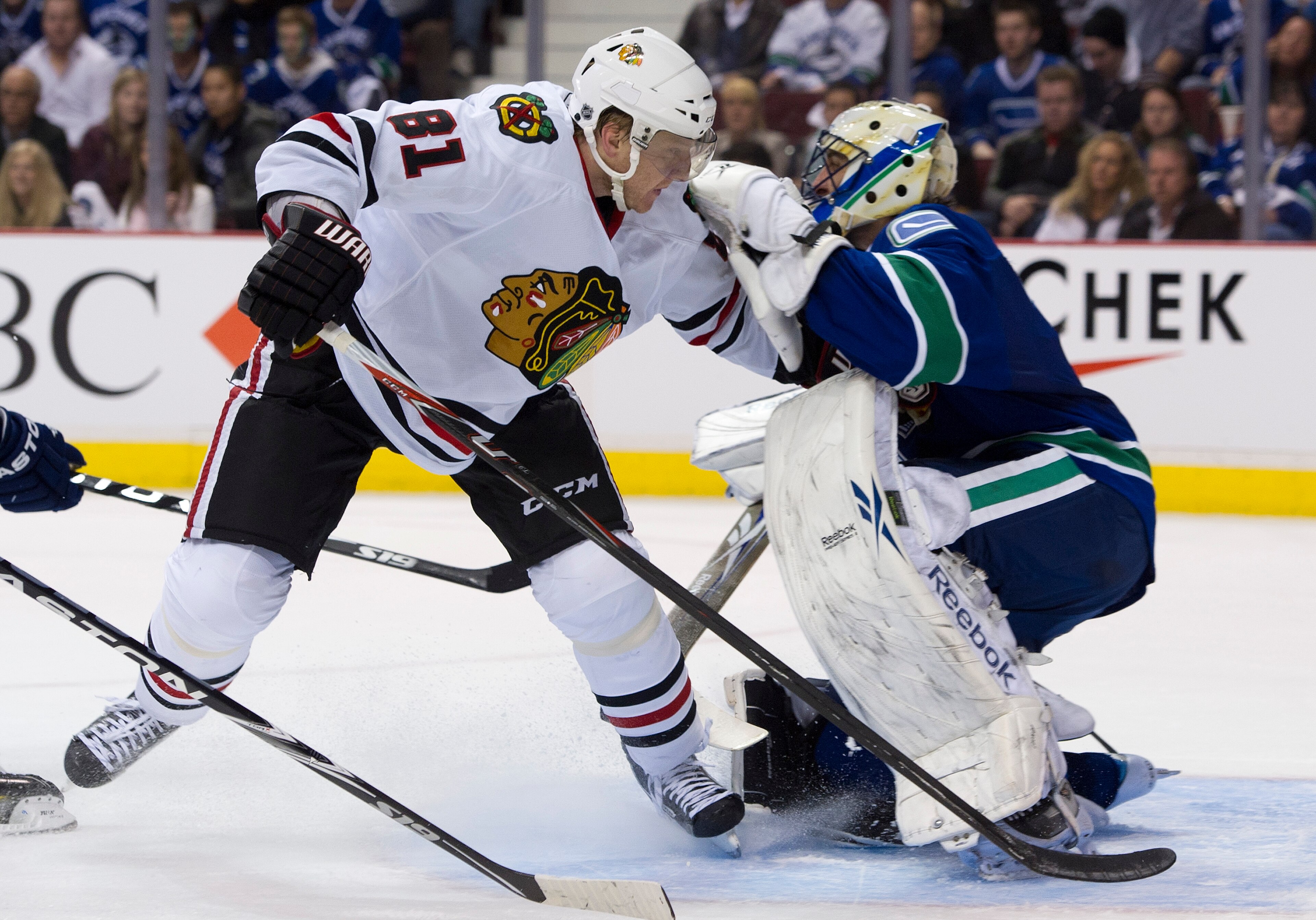 VANCOUVER, CANADA - APRIL 13: Marian Hossa #81 of the Chicago Blackhawks skates into goalie Roberto Luongo #1 after getting pushed during the third period in Game One of the Western Conference Quarterfinals during the 2011 NHL Stanley Cup Playoffs on Apri VANCOUVER, CANADA - APRIL 13: Marian Hossa #81 of the Chicago Blackhawks skates into goalie Roberto Luongo #1 after getting pushed during the third period in Game One of the Western Conference Quarterfinals during the 2011 NHL Stanley Cup Playoffs on Apri