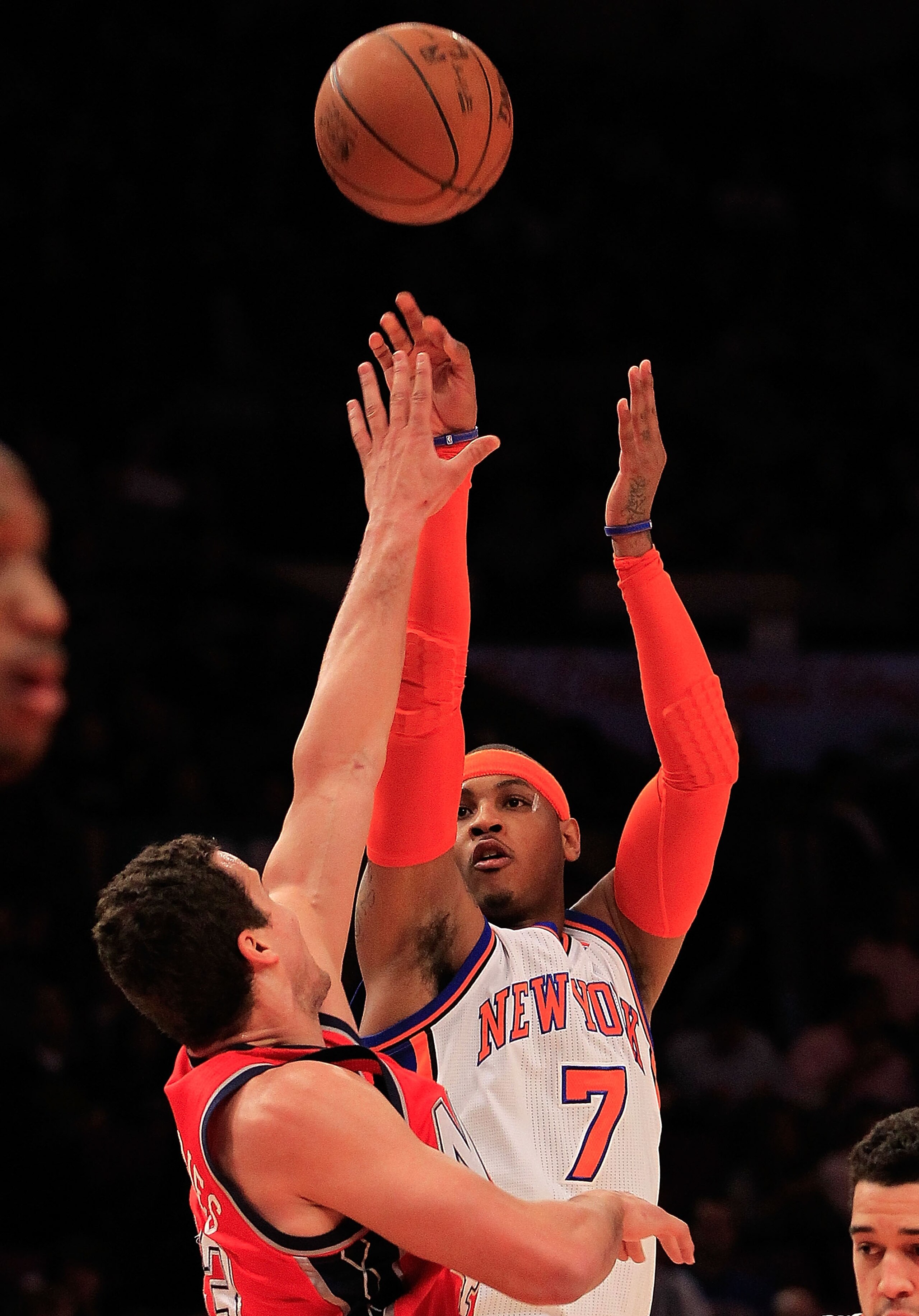 NEW YORK, NY - MARCH 30:  Carmelo Anthony #7 of the New York Knicks shoots over Kris Humphries #43 of the New Jersey Nets at Madison Square Garden on March 30, 2011 in New York City. NOTE TO USER: User expressly acknowledges and agrees that, by downloadin