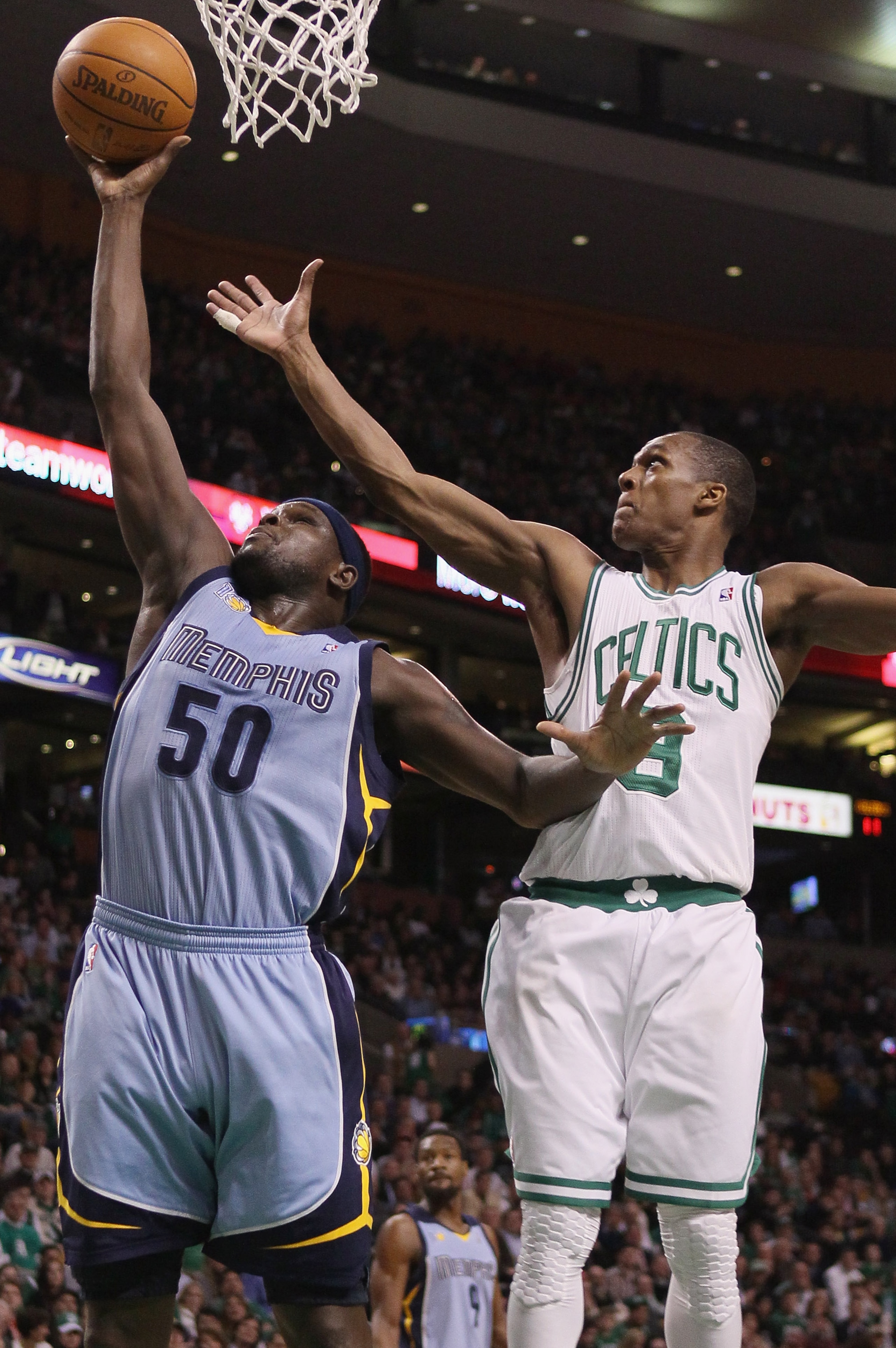 BOSTON, MA - MARCH 23:  Zach Randolph #50 of the Memphis Grizzlies takes a shot as Rajon Rondo #9 of the Boston Celtics defends on March 23, 2011 at the TD Garden in Boston, Massachusetts.  NOTE TO USER: User expressly acknowledges and agrees that, by dow