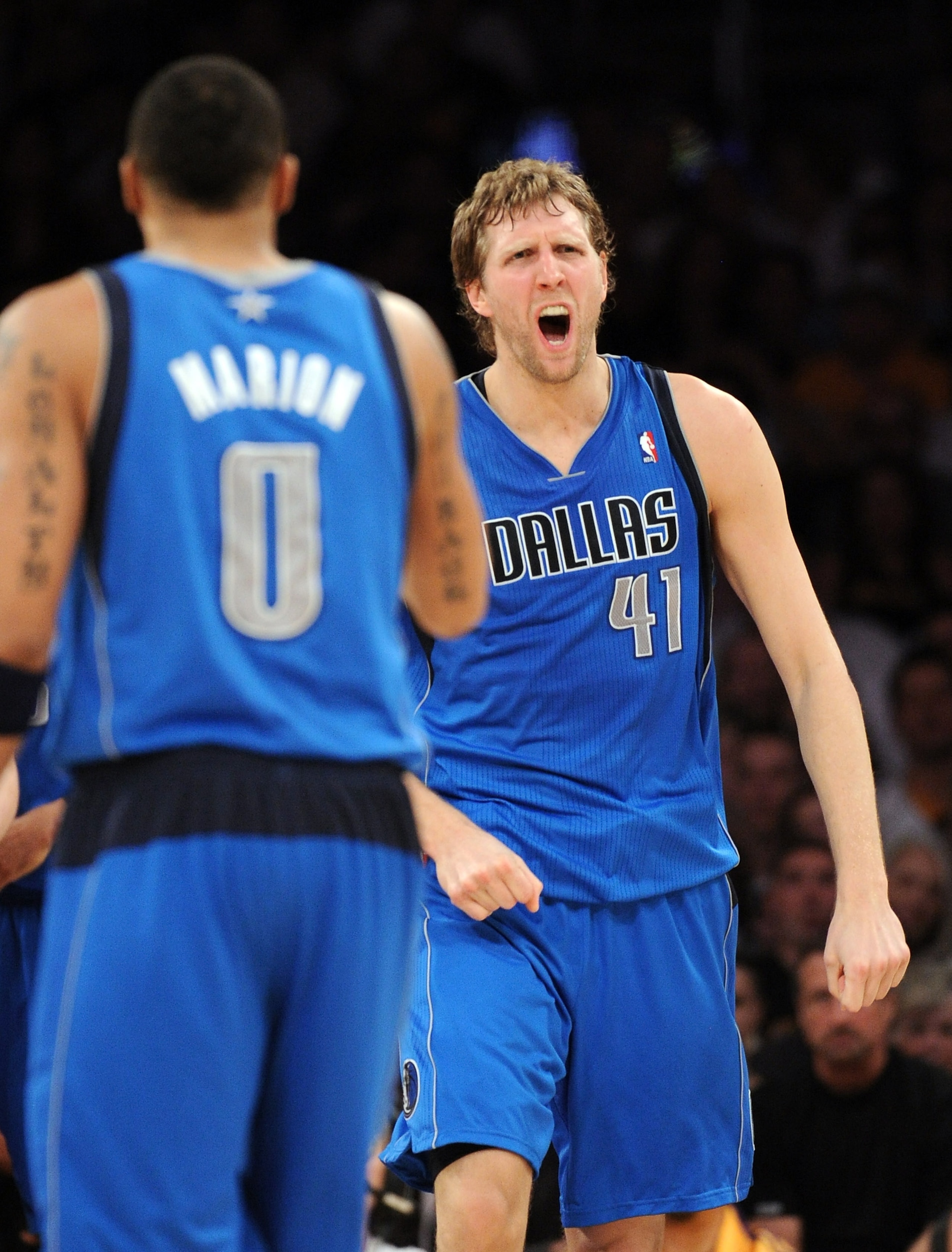 LOS ANGELES, CA - MARCH 31:  Dirk Nowitzki #41 of the Dallas Mavericks reacts to his basket in front of Shawn Marion #0 against the Los Angeles Lakers at Staples Center on March 31, 2011 in Los Angeles, California.  NOTE TO USER: User expressly acknowledg