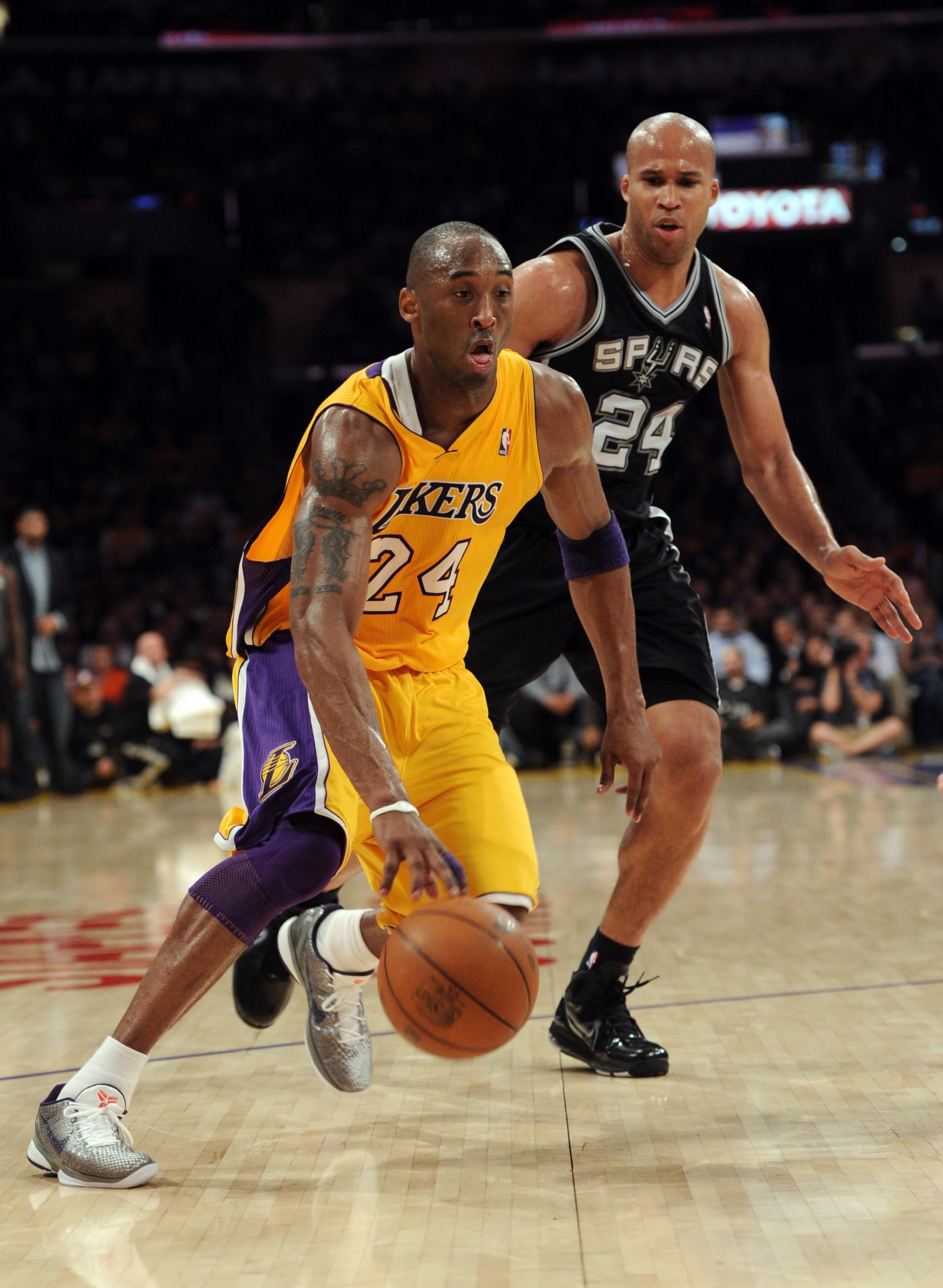 LOS ANGELES, CA - APRIL 12:  Kobe Bryant #24 of the Los Angeles Lakers drives on Richard Jefferson #24 of the San Antonio Spurs at Staples Center on April 12, 2011 in Los Angeles, California.  NOTE TO USER: User expressly acknowledges and agrees that, by