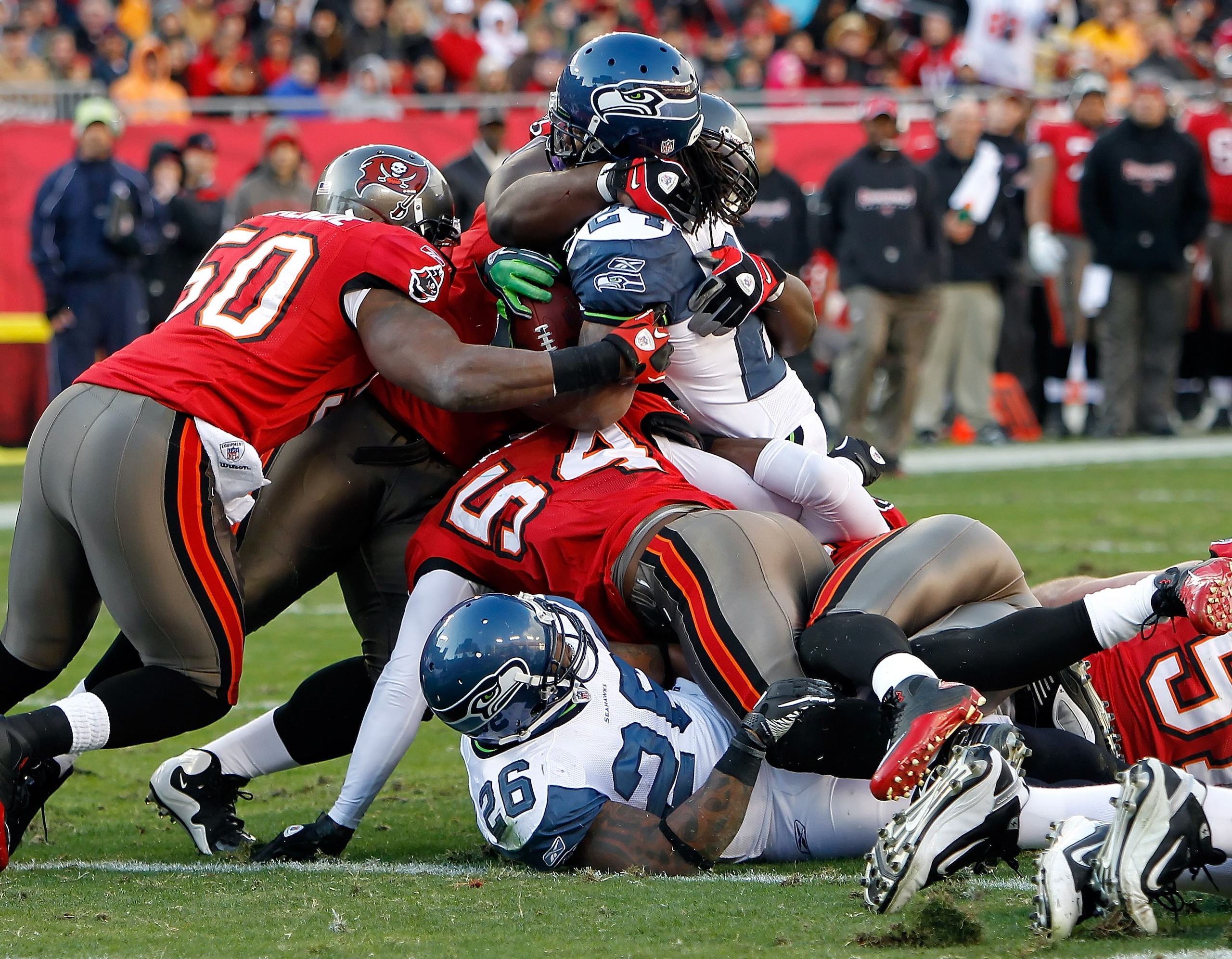 TAMPA, FL - DECEMBER 26: Running back Marshawn Lynch #24 of the Seattle Seahawks is stopped at the goal line by the Tampa Bay Buccaneers defense during the game at Raymond James Stadium on December 26, 2010 in Tampa, Florida. (Photo by J. Meric/Getty Imag