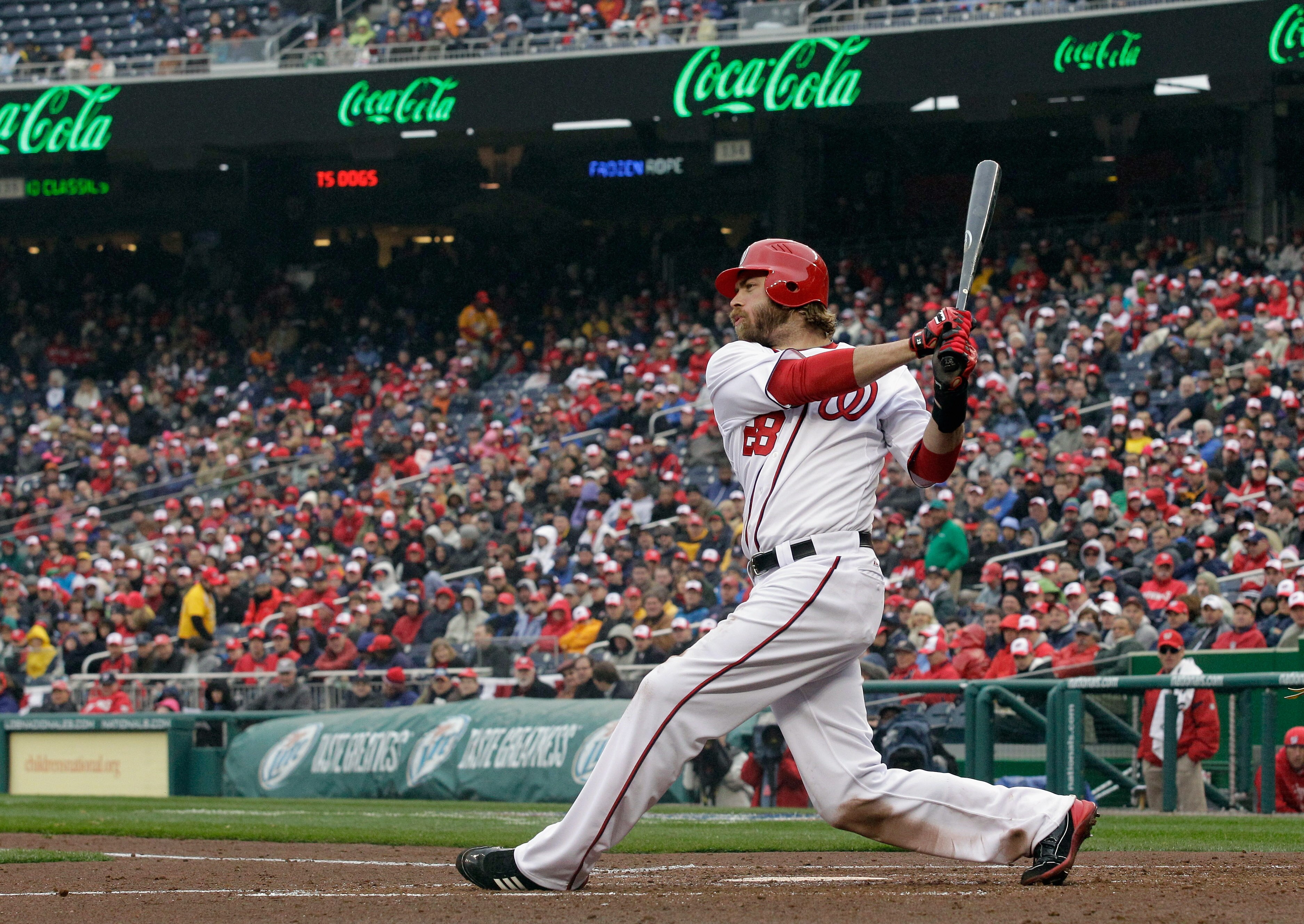 WASHINGTON, DC - MARCH 31:  Jayson Werth #28 of the Washington Nationals takes a swing against the Atlanta Braves in the third inning at Nationals Park on March 31, 2011 in Washington, DC.  (Photo by Rob Carr/Getty Images)