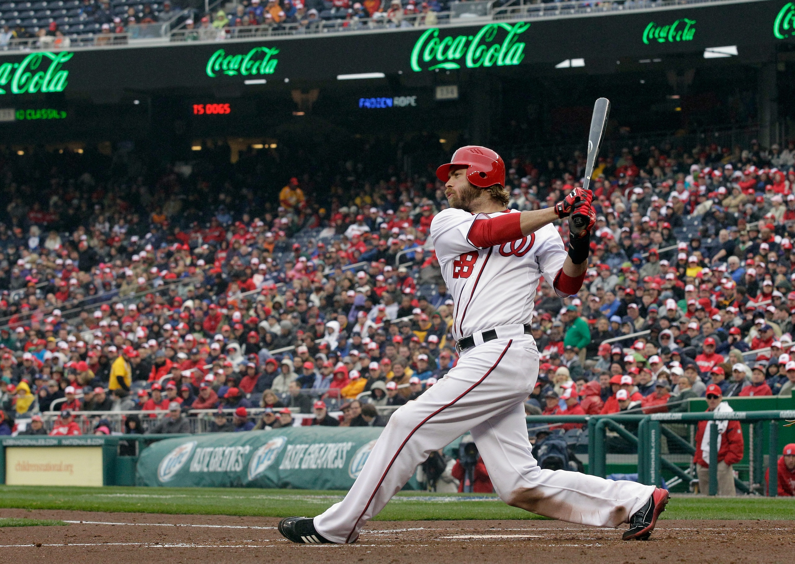 WASHINGTON, DC - MARCH 31:  Jayson Werth #28 of the Washington Nationals takes a swing against the Atlanta Braves in the third inning at Nationals Park on March 31, 2011 in Washington, DC.  (Photo by Rob Carr/Getty Images)