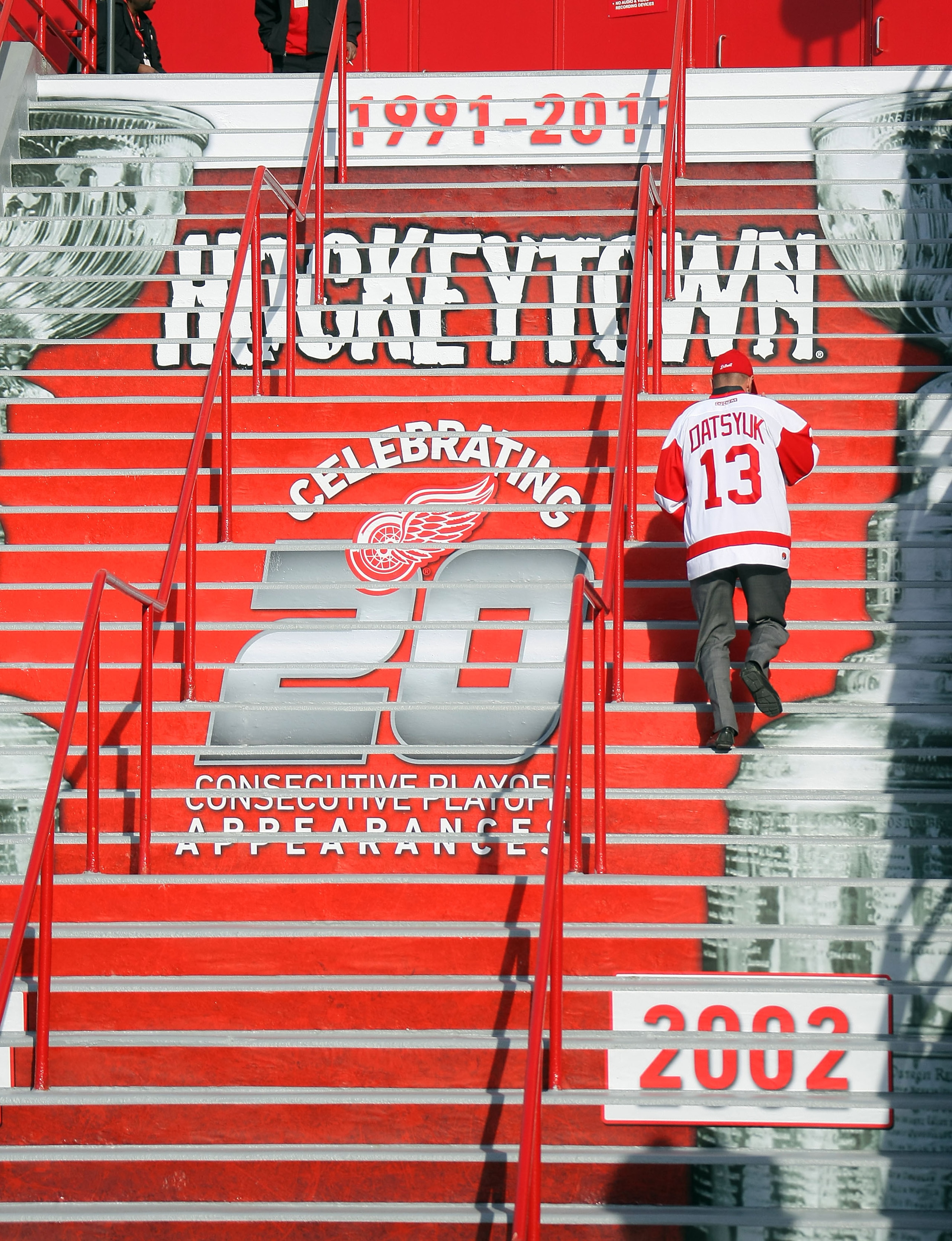 DETROIT, MI - APRIL 13:  A fan climbs the stairs to enter the arena to see the Phoenix Coyotes play the Detroit Red Wings in Game One of the Western Conference Quarterfinals during the 2011 NHL Stanley Cup Playoffs at at Joe Louis Arena on April 13, 2011