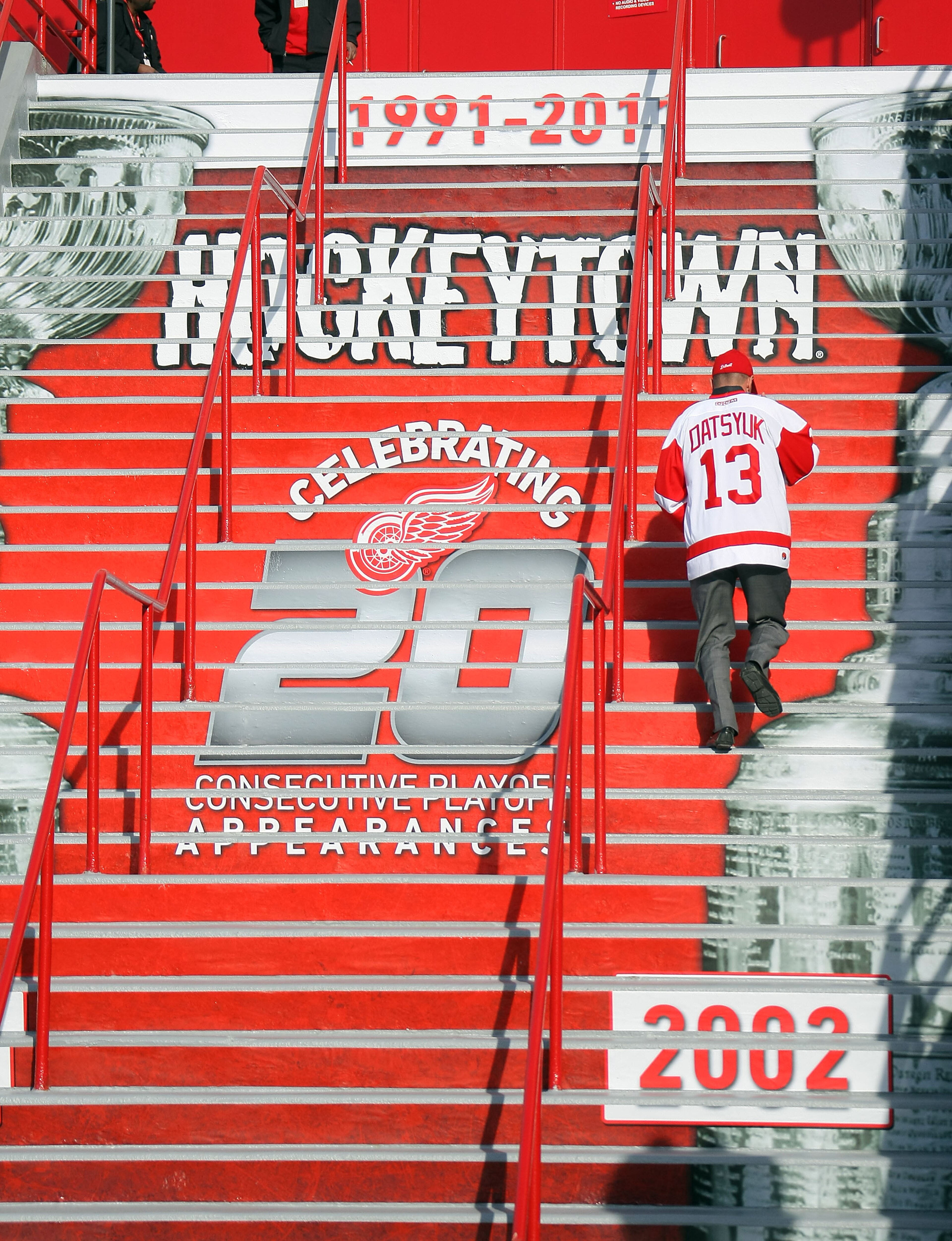 DETROIT, MI - APRIL 13:  A fan climbs the stairs to enter the arena to see the Phoenix Coyotes play the Detroit Red Wings in Game One of the Western Conference Quarterfinals during the 2011 NHL Stanley Cup Playoffs at at Joe Louis Arena on April 13, 2011