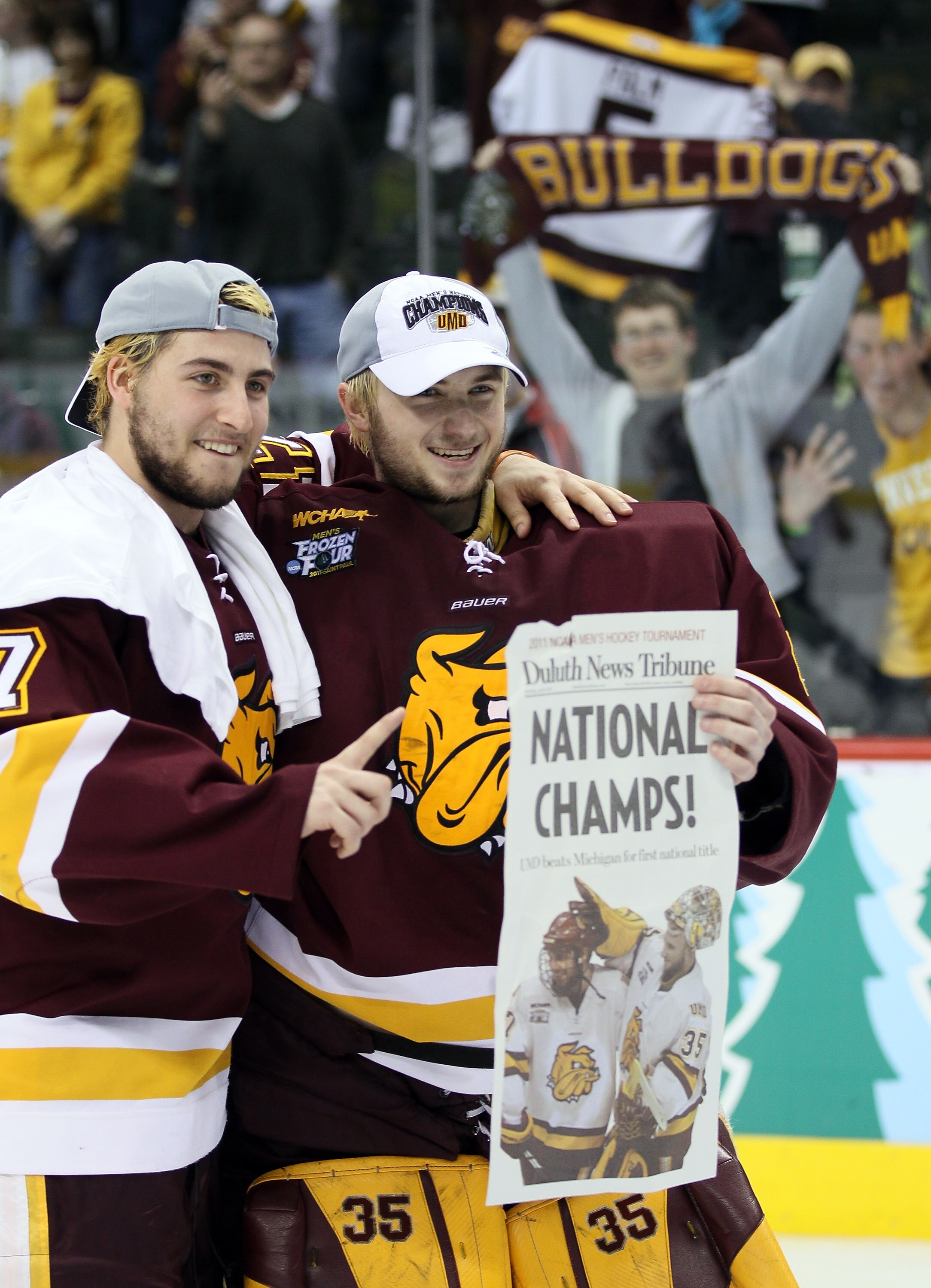 ST. PAUL, MN - APRIL 09:  Mike Seidel #17 and Kenny Reiter #35 of the Minnesota Duluth Bulldogs  celebrate after the championship game of the 2011 NCAA Men's Frozen Four on April 9, 2011 at the Xcel Energy Center in St. Paul, Minnesota. The Minnesota Dulu
