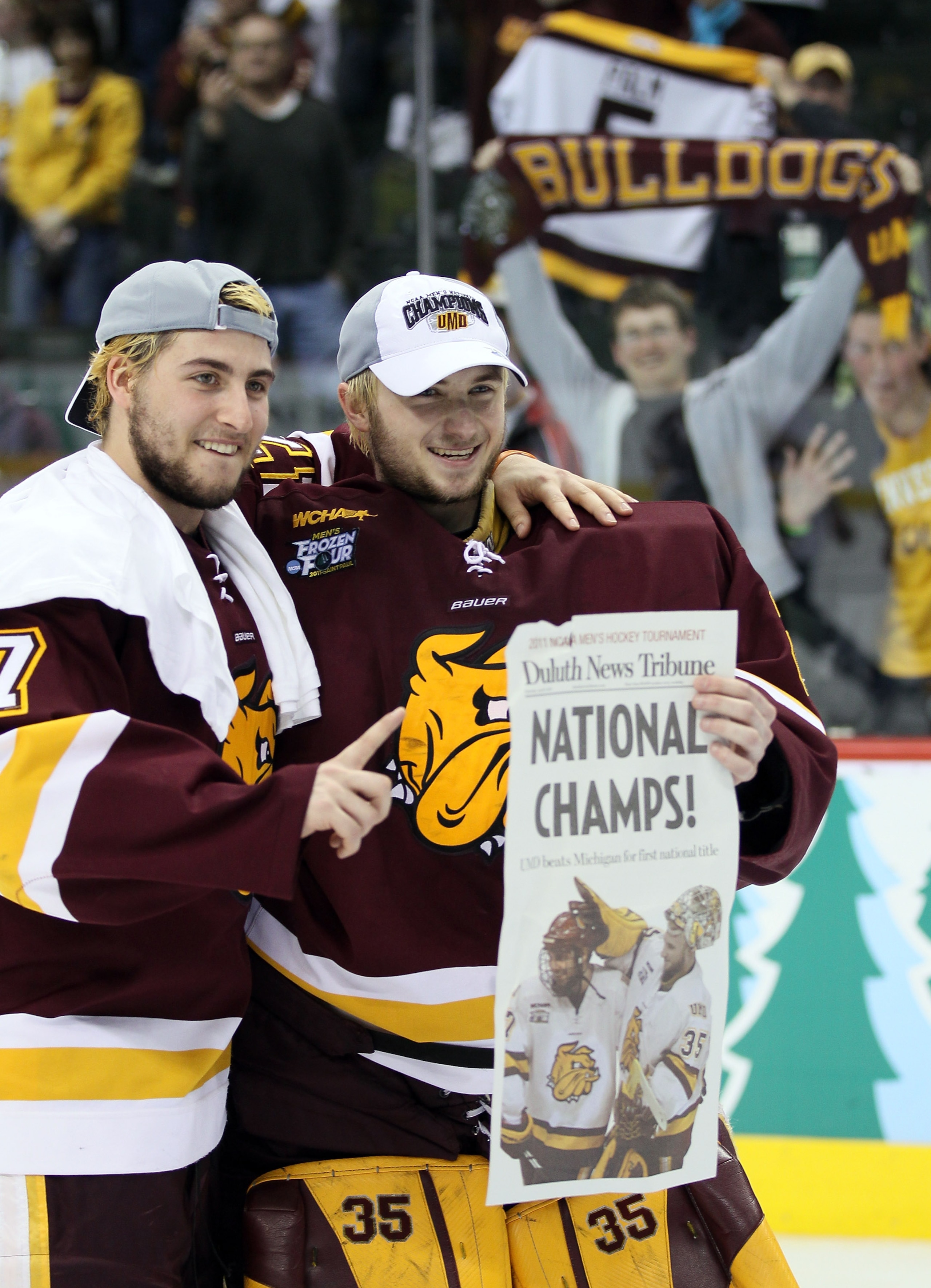 ST. PAUL, MN - APRIL 09:  Mike Seidel #17 and Kenny Reiter #35 of the Minnesota Duluth Bulldogs  celebrate after the championship game of the 2011 NCAA Men's Frozen Four on April 9, 2011 at the Xcel Energy Center in St. Paul, Minnesota. The Minnesota Dulu