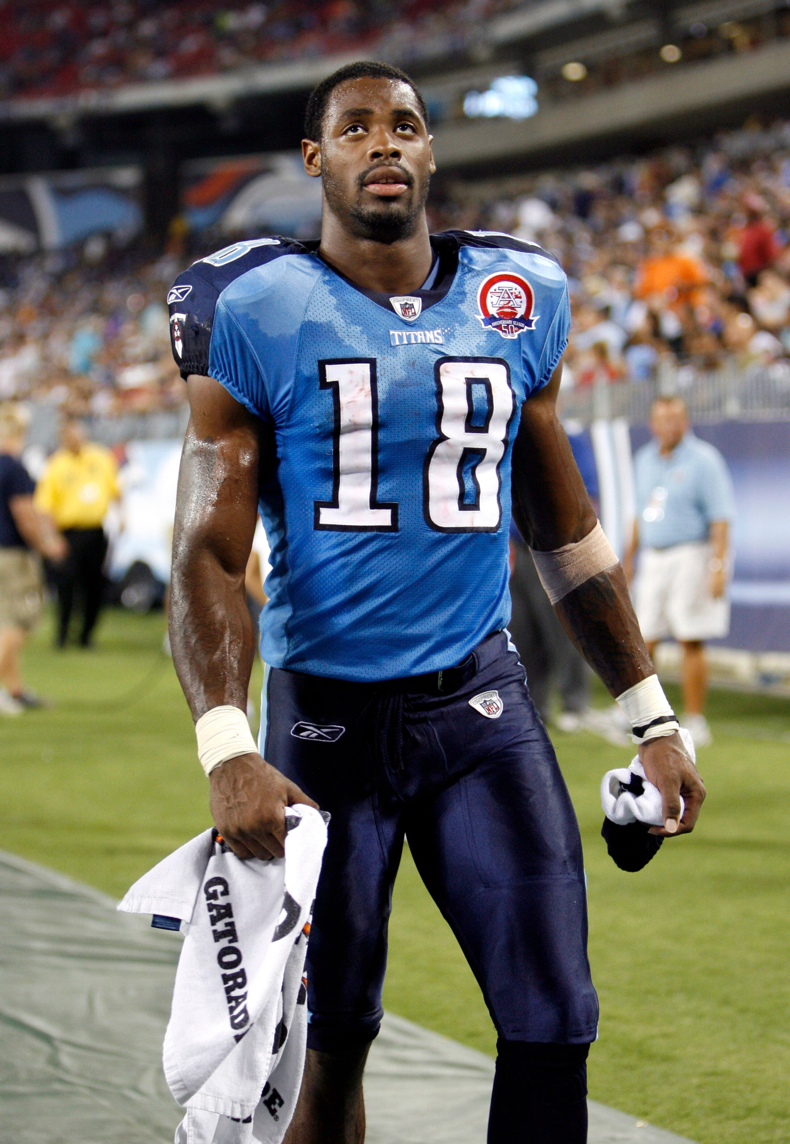NASHVILLE, TN - AUGUST 15: Kenny Britt #18 of the Tennessee Titans looks on against the Tampa Bay Buccaneers during a preseason NFL game at LP Field on August 15, 2009 in Nashville, Tennessee. The Titans beat the Buccaneers 27-20. (Photo by Joe Murphy/Get