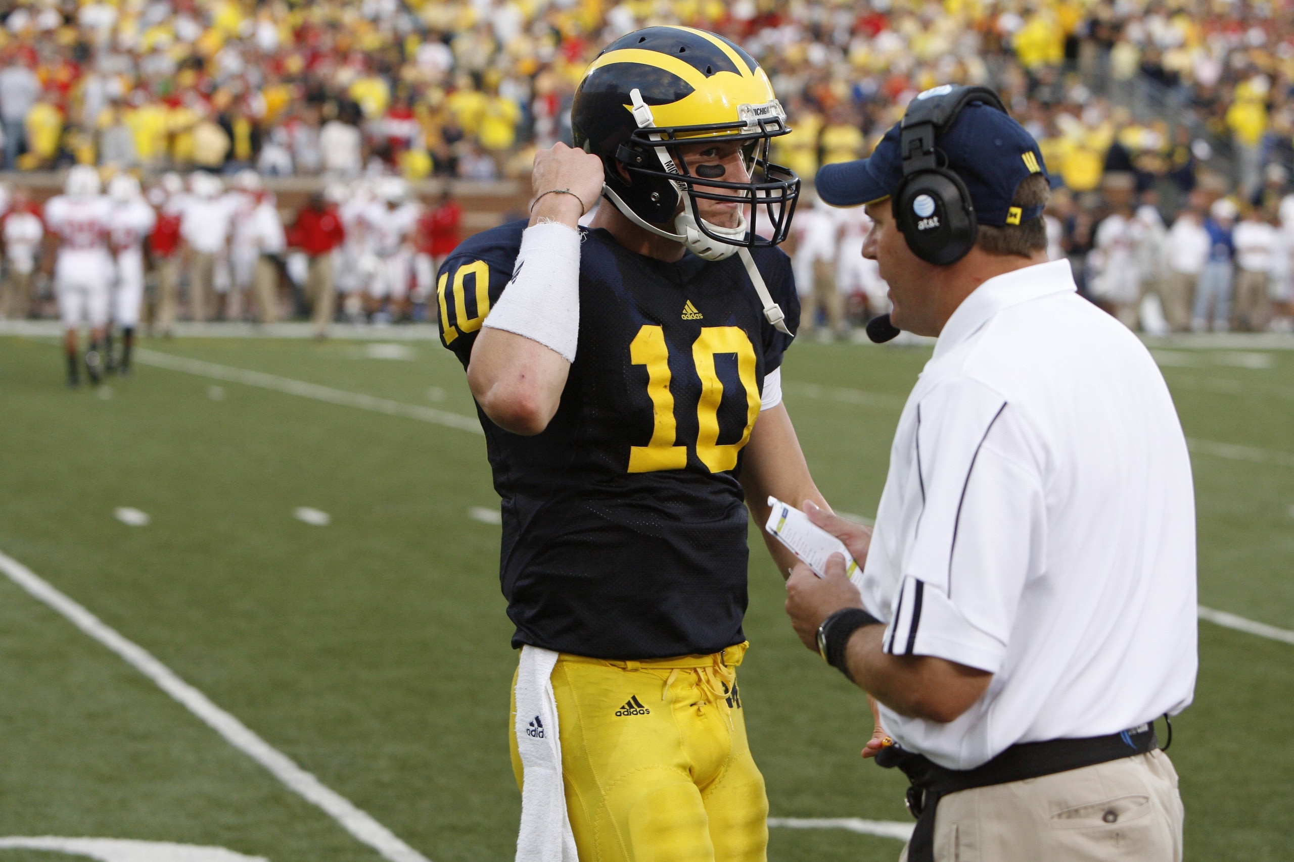 ANN ARBOR, MI - SEPTEMBER 27: Steven Threet #10 of the Michigan Wolverines walks toward head coach Rich Rodriguez during the game against the Wisconsin Badgers on September 27, 2008 at Michigan Stadium in Ann Arbor, Michigan. (Photo by Gregory Shamus/Get ANN ARBOR, MI - SEPTEMBER 27: Steven Threet #10 of the Michigan Wolverines walks toward head coach Rich Rodriguez during the game against the Wisconsin Badgers on September 27, 2008 at Michigan Stadium in Ann Arbor, Michigan. (Photo by Gregory Shamus/Get