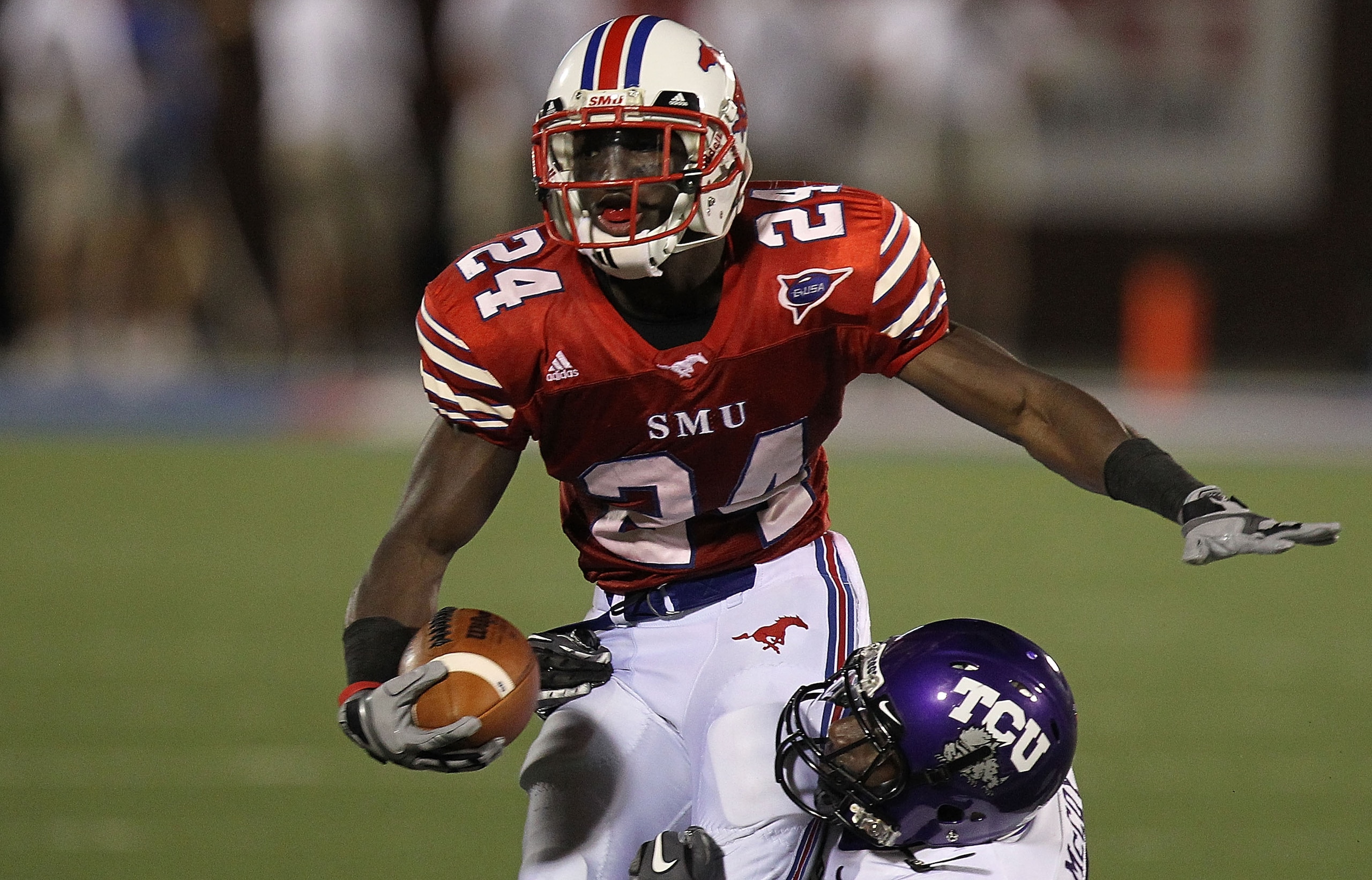 DALLAS - SEPTEMBER 24: Wide receiver Aldrick Robinson #24 of the SMU Mustangs is tackled by Greg McCoy #7 of the TCU Horned Frogs at Gerald J. Ford Stadium on September 24, 2010 in Dallas, Texas. (Photo by Ronald Martinez/Getty Images) DALLAS - SEPTEMBER 24: Wide receiver Aldrick Robinson #24 of the SMU Mustangs is tackled by Greg McCoy #7 of the TCU Horned Frogs at Gerald J. Ford Stadium on September 24, 2010 in Dallas, Texas. (Photo by Ronald Martinez/Getty Images)