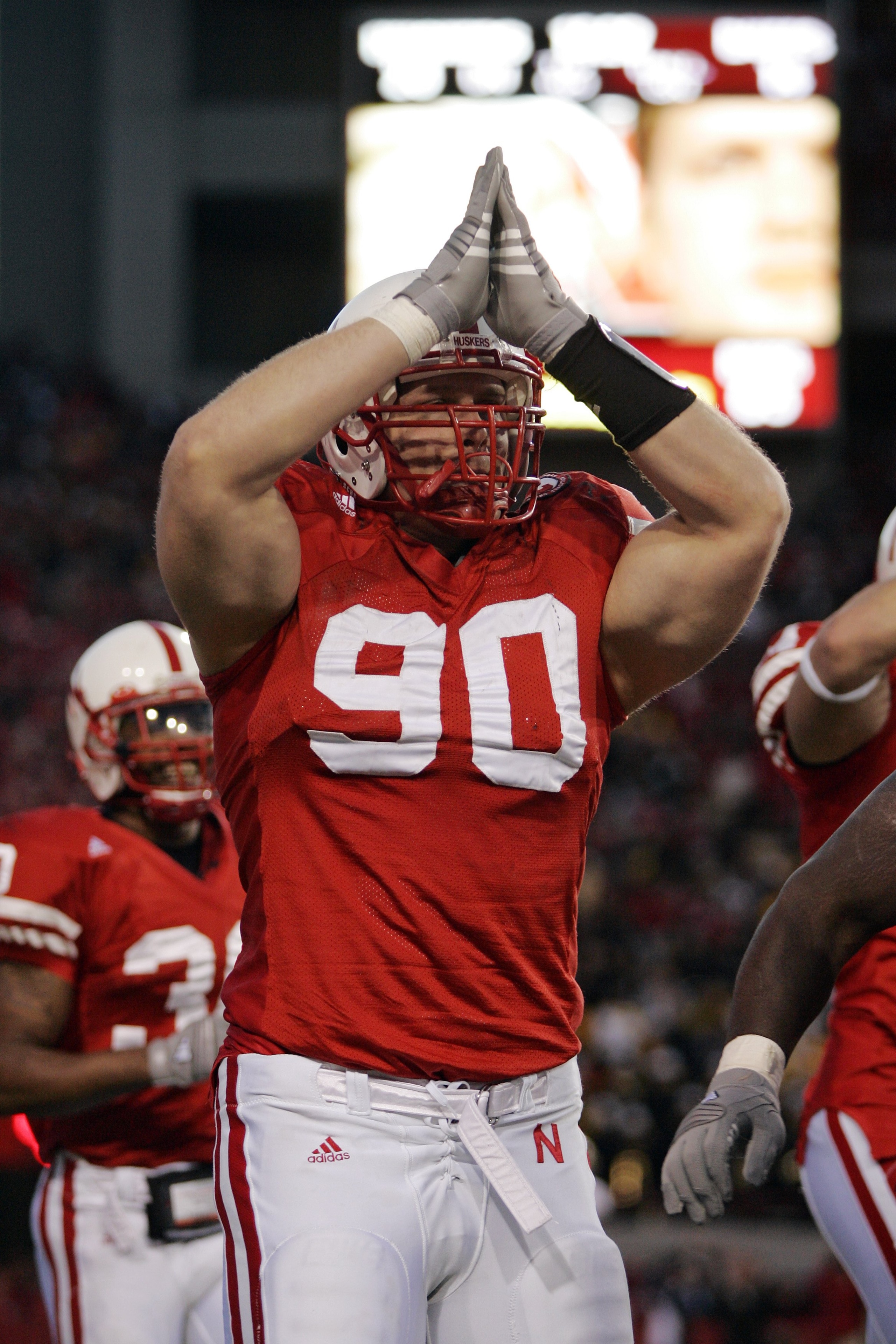 LINCOLN, NE - NOVEMBER 24:  Defensive end Adam Carriker #90 of the Nebraska Cornhuskers celebrates his safety against the Colorado Buffaloes in the fourth quarter on November 24, 2006 at Memorial Stadium in Lincoln, Nebraska.  Nebraska won 37-14.  (Photo