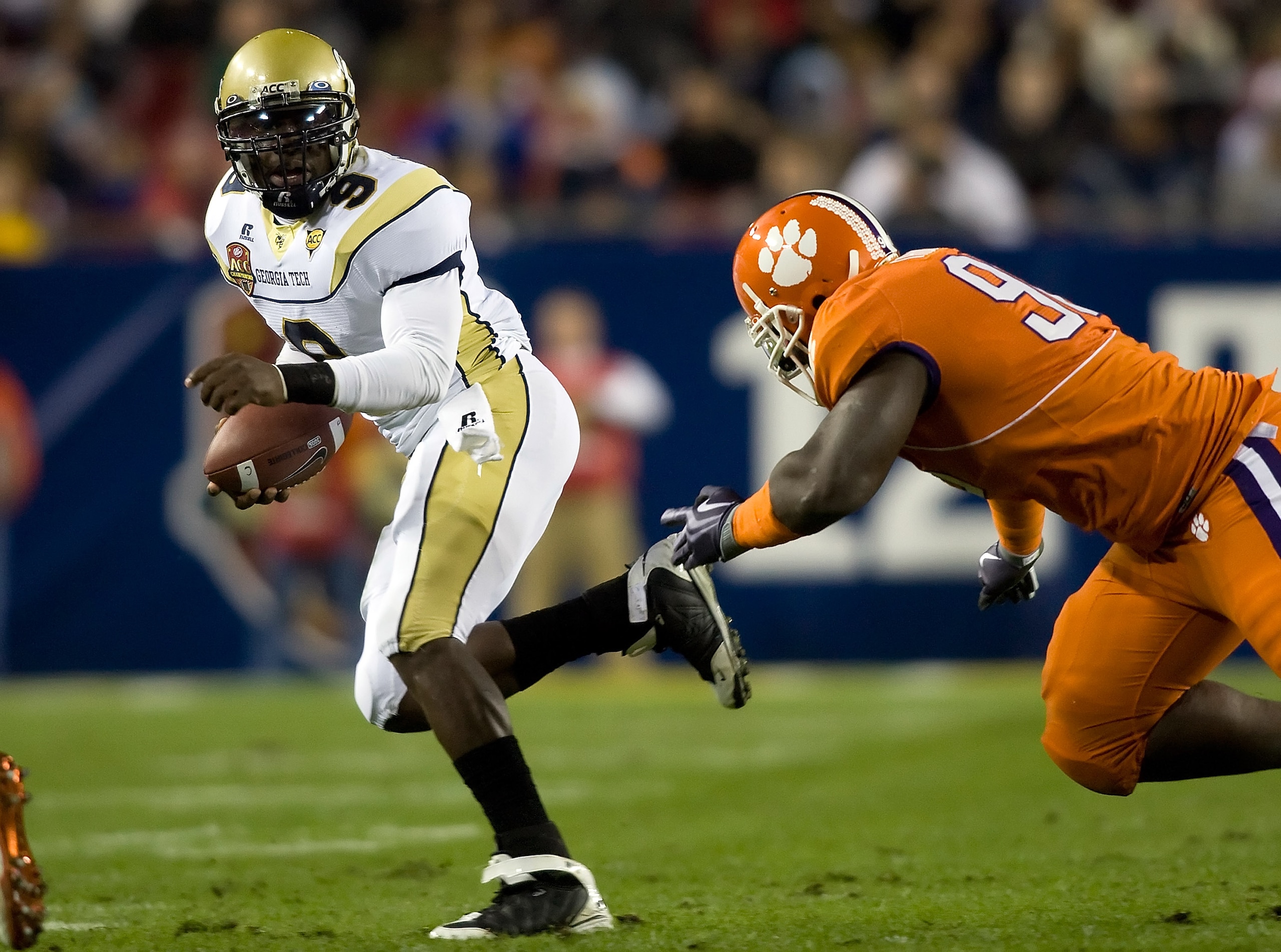 TAMPA - DECEMBER 05:  Defensive end Da'Quan Bowers #93 of the Clemson Tigers pursues quarterback Josh Nesbitt #9 of the Georgia Tech Yellow Jackets in the 2009 ACC Football Championship game at Raymond James Stadium on December 5, 2009 in Tampa, Florida.