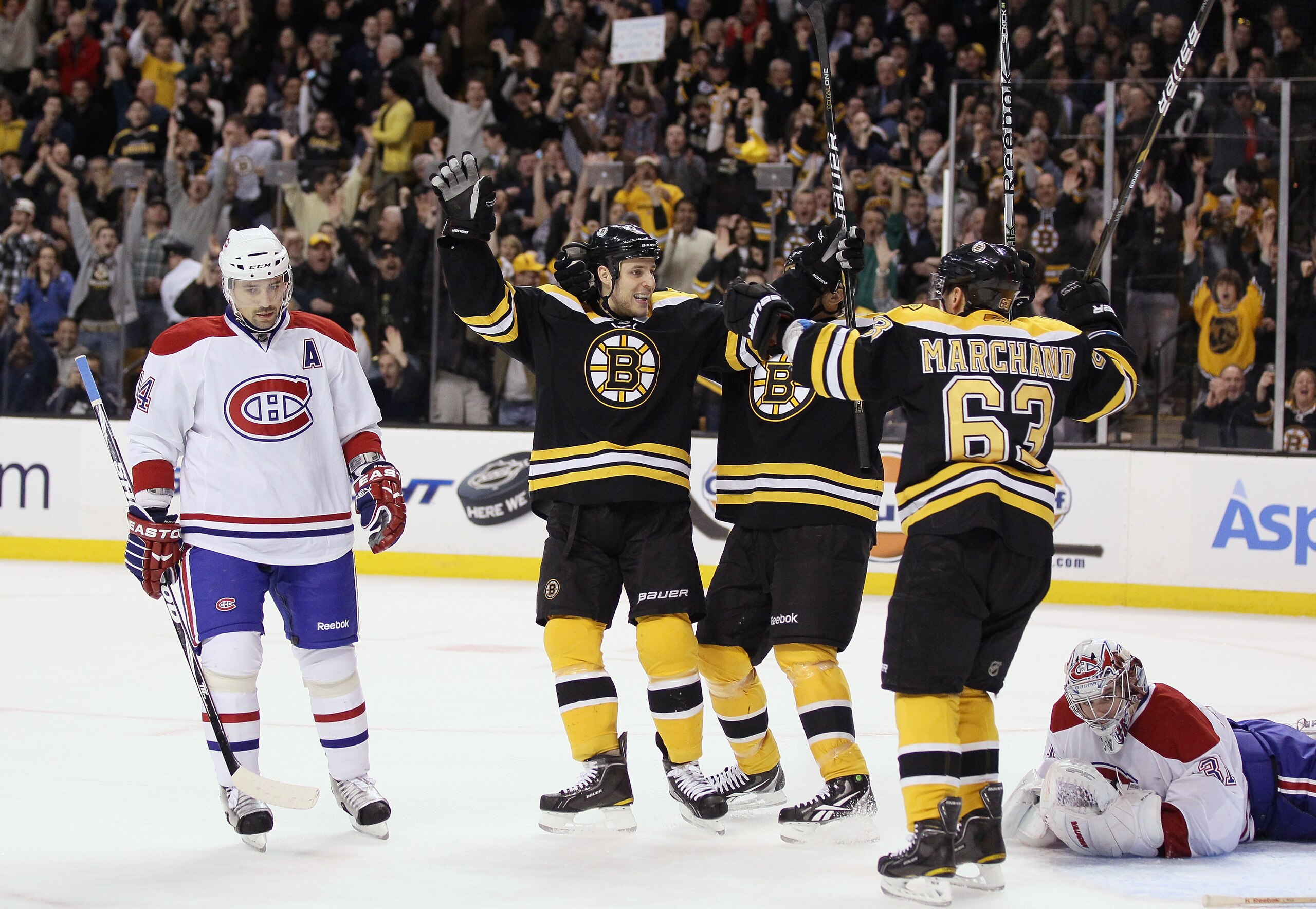 BOSTON, MA - MARCH 24:  Gregory Campbell #11 of the Boston Bruins celebrates his goal with teammate Brad Marchand #63 as Carey Price #31 and Tomas Plekanec #14 of the Montreal Canadiens look on March 24, 2011 at the TD Garden in Boston, Massachusetts.  (P