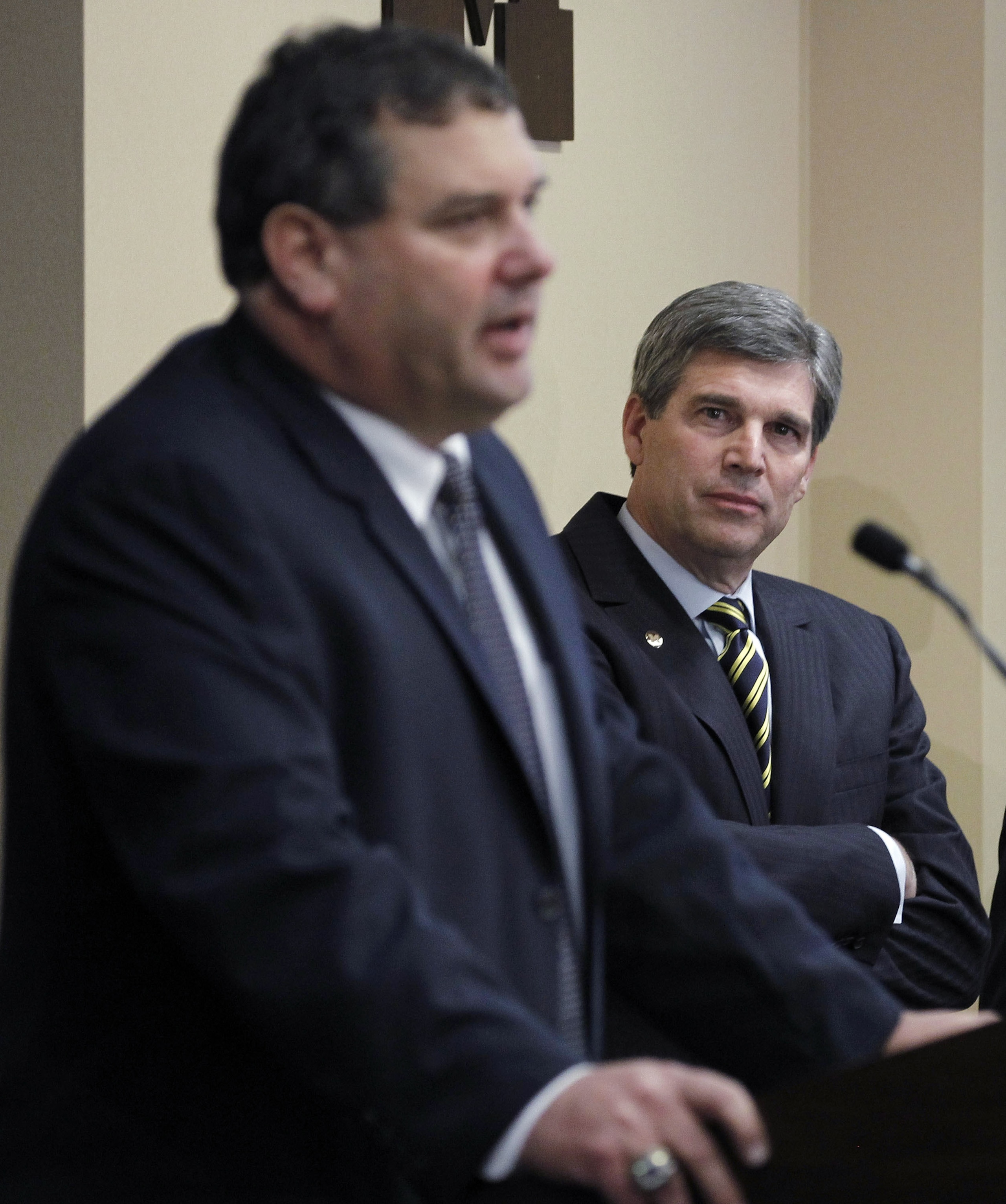 ANN ARBOR, MI - JANUARY 12: New University of Michigan head football coach Brady Hoke (L) speaks to the media as, Athletic Director Dave Brandon looks on, after introducing Hoke as the nineteenth Michigan head football coach in Michigan history at the Ju ANN ARBOR, MI - JANUARY 12: New University of Michigan head football coach Brady Hoke (L) speaks to the media as, Athletic Director Dave Brandon looks on, after introducing Hoke as the nineteenth Michigan head football coach in Michigan history at the Ju