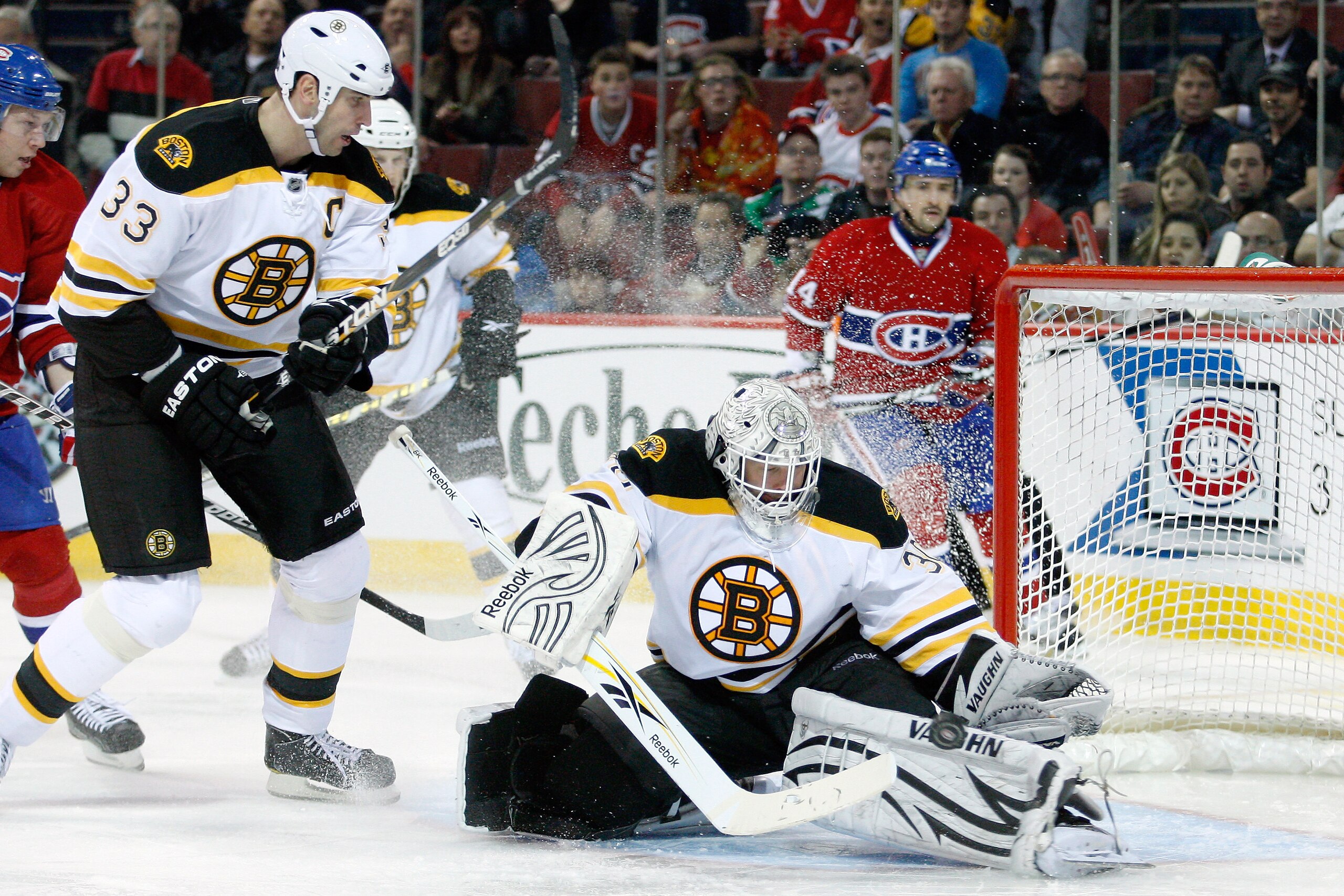 MONTREAL, CANADA - DECEMBER 16:  Tim Thomas #30 of the Boston Bruins makes a pad save on the puck during the NHL game against the Montreal Canadiens at the Bell Centre on December 16, 2010 in Montreal, Quebec, Canada.  (Photo by Richard Wolowicz/Getty Ima