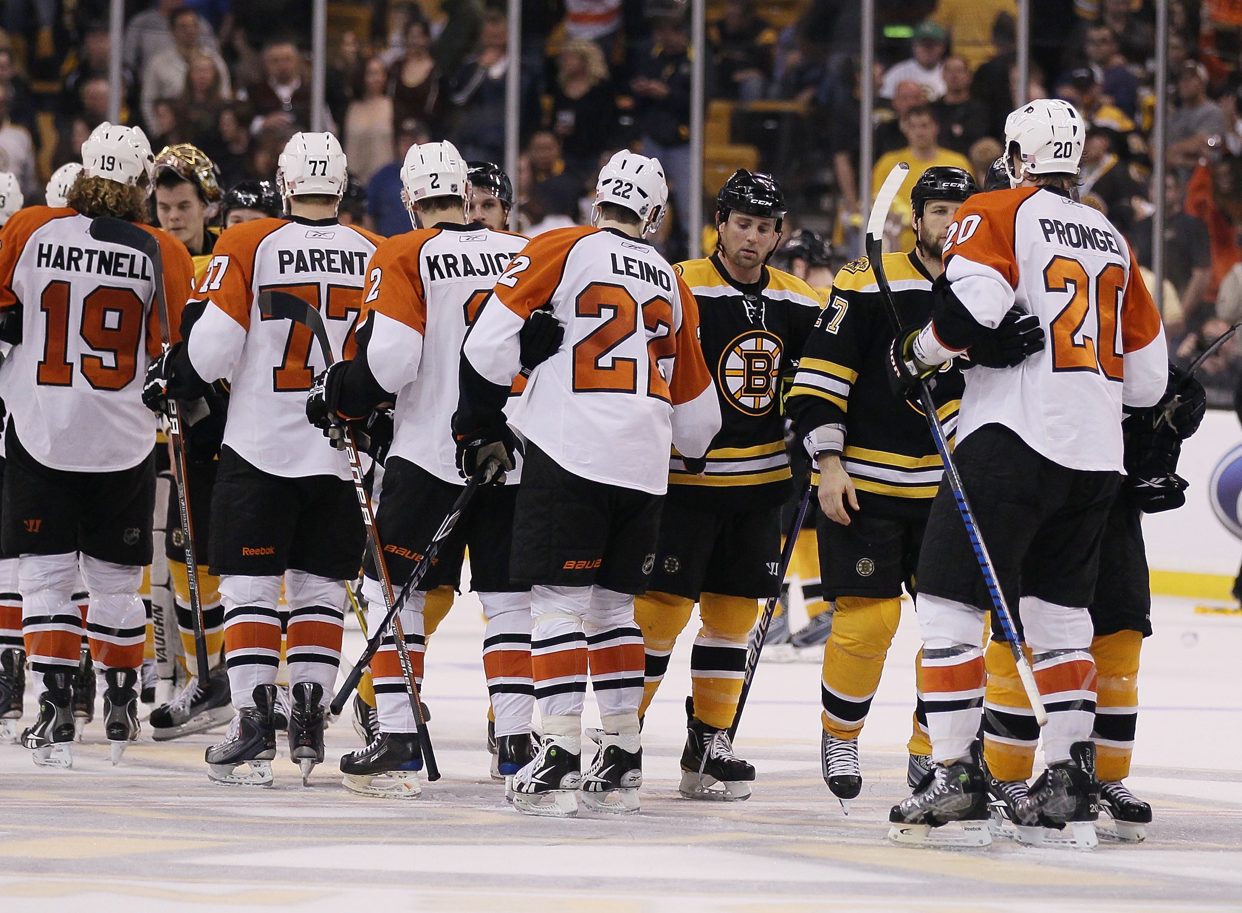 BOSTON - MAY 14:  Steve Begin #27 and Marc Savard #91 of the Boston Bruins congratulate Chris Pronger #20 and the rest of the Philadelphia Flyers in Game Seven of the Eastern Conference Semifinals during the 2010 NHL Stanley Cup Playoffs at TD Garden on M