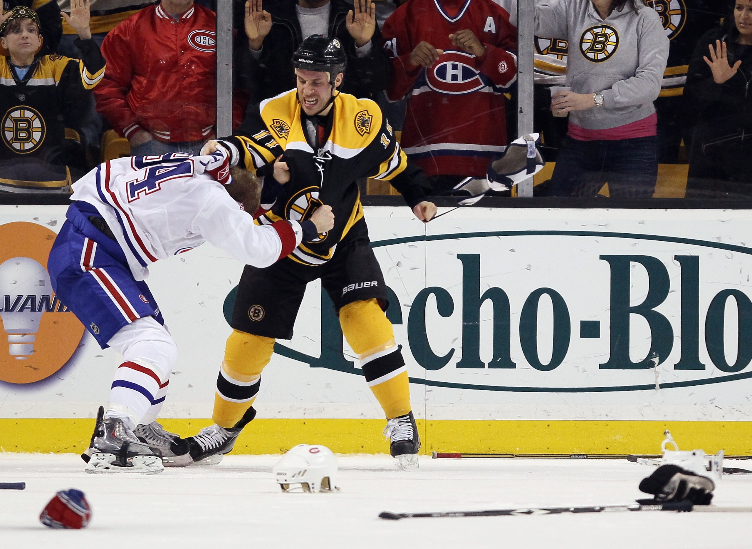 BOSTON, MA - FEBRUARY 09:  Gregory Campbell #11 of the Boston Bruins and Tom Pyatt #94 of the Montreal Canadiens fight in the third period on February 9, 2011 at the TD Garden in Boston, Massachusetts. The Bruins defeated the Canadiens 8-6.  (Photo by Els