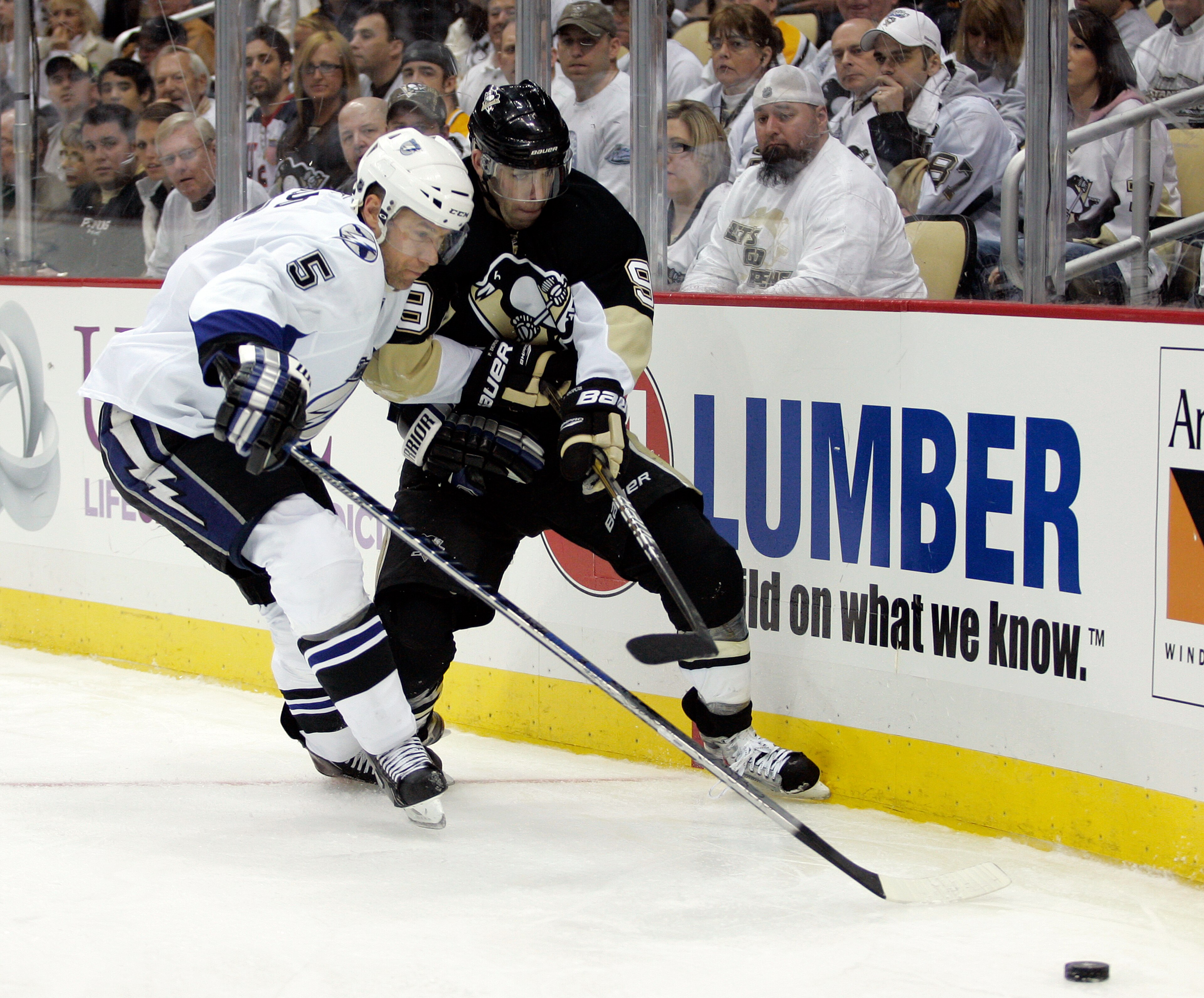 PITTSBURGH, PA - APRIL 13: Pascal Dupuis #9 of the Pittsburgh Penguins battles in the corner against Mattias Ohlund #5 of the Tampa Bay Lightning in Game One of the Eastern Conference Quarterfinals during the 2011 NHL Stanley Cup Playoffs at Consol Energ PITTSBURGH, PA - APRIL 13: Pascal Dupuis #9 of the Pittsburgh Penguins battles in the corner against Mattias Ohlund #5 of the Tampa Bay Lightning in Game One of the Eastern Conference Quarterfinals during the 2011 NHL Stanley Cup Playoffs at Consol Energ