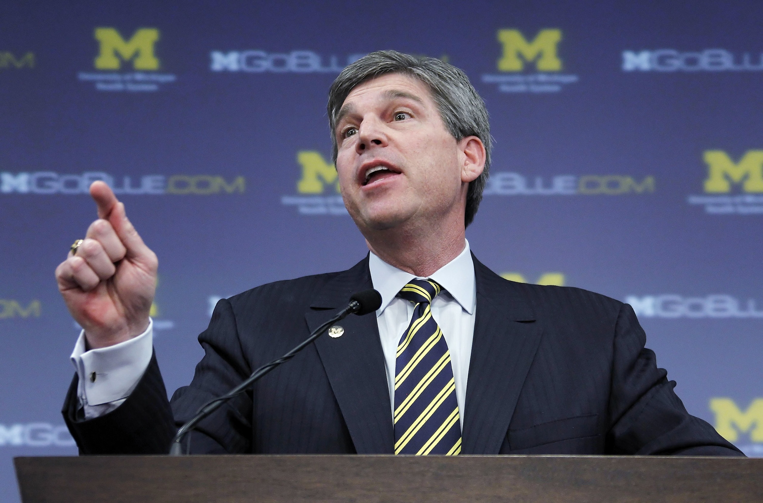 ANN ARBOR, MI - JANUARY 12: University of Michigan Athletic Director Dave Brandon speaks to the media after being introducing Brady Hoke as the new head football coach to the media at the Junge Family Champions Center on January 12, 2011 in Ann Arbor, Mic ANN ARBOR, MI - JANUARY 12: University of Michigan Athletic Director Dave Brandon speaks to the media after being introducing Brady Hoke as the new head football coach to the media at the Junge Family Champions Center on January 12, 2011 in Ann Arbor, Mic