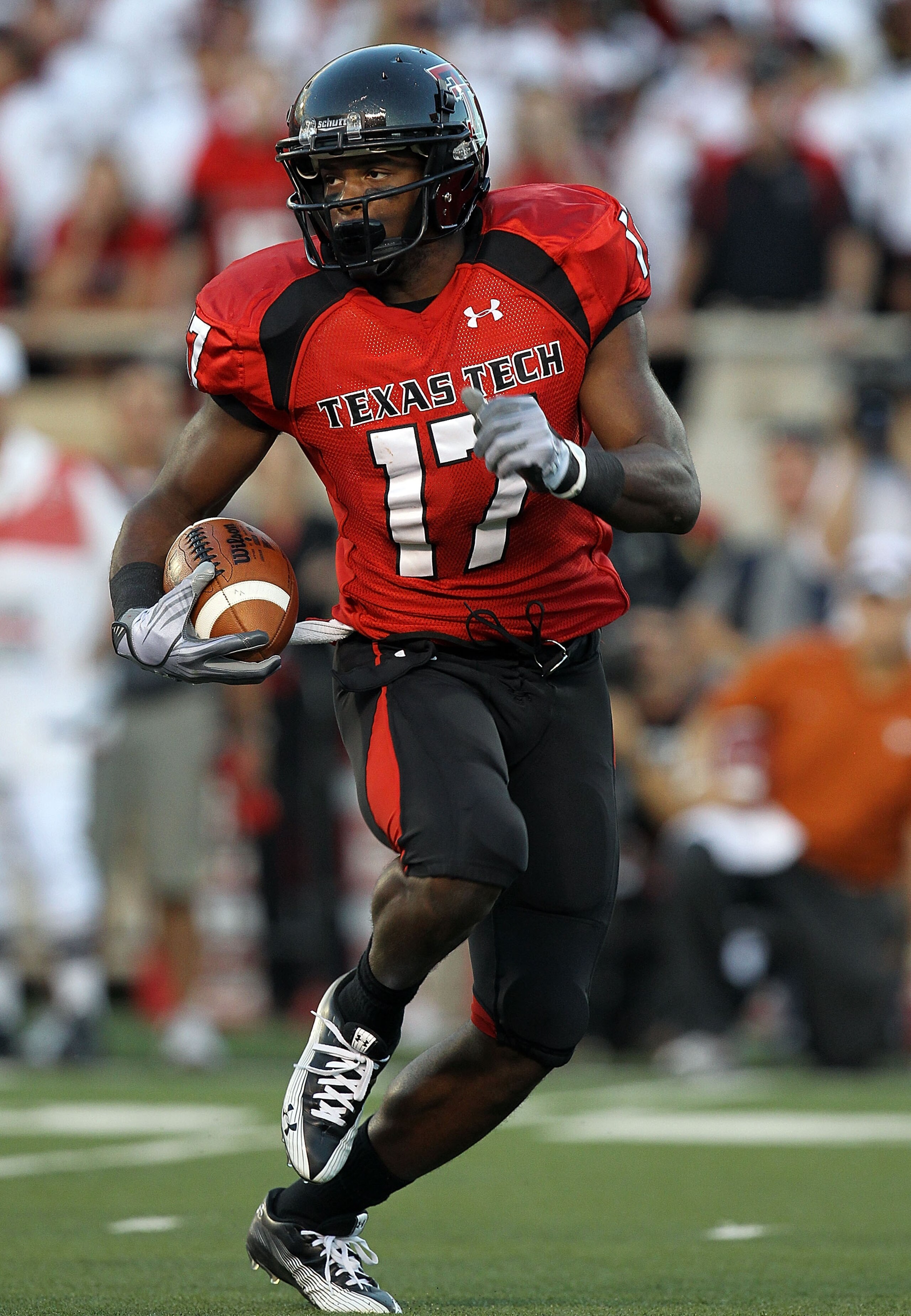 LUBBOCK, TX - SEPTEMBER 18:  Detron Lewis #17 of the Texas Tech Red Raiders runs the ball against the Texas Longhorns at Jones AT&T Stadium on September 18, 2010 in Lubbock, Texas.  (Photo by Ronald Martinez/Getty Images)