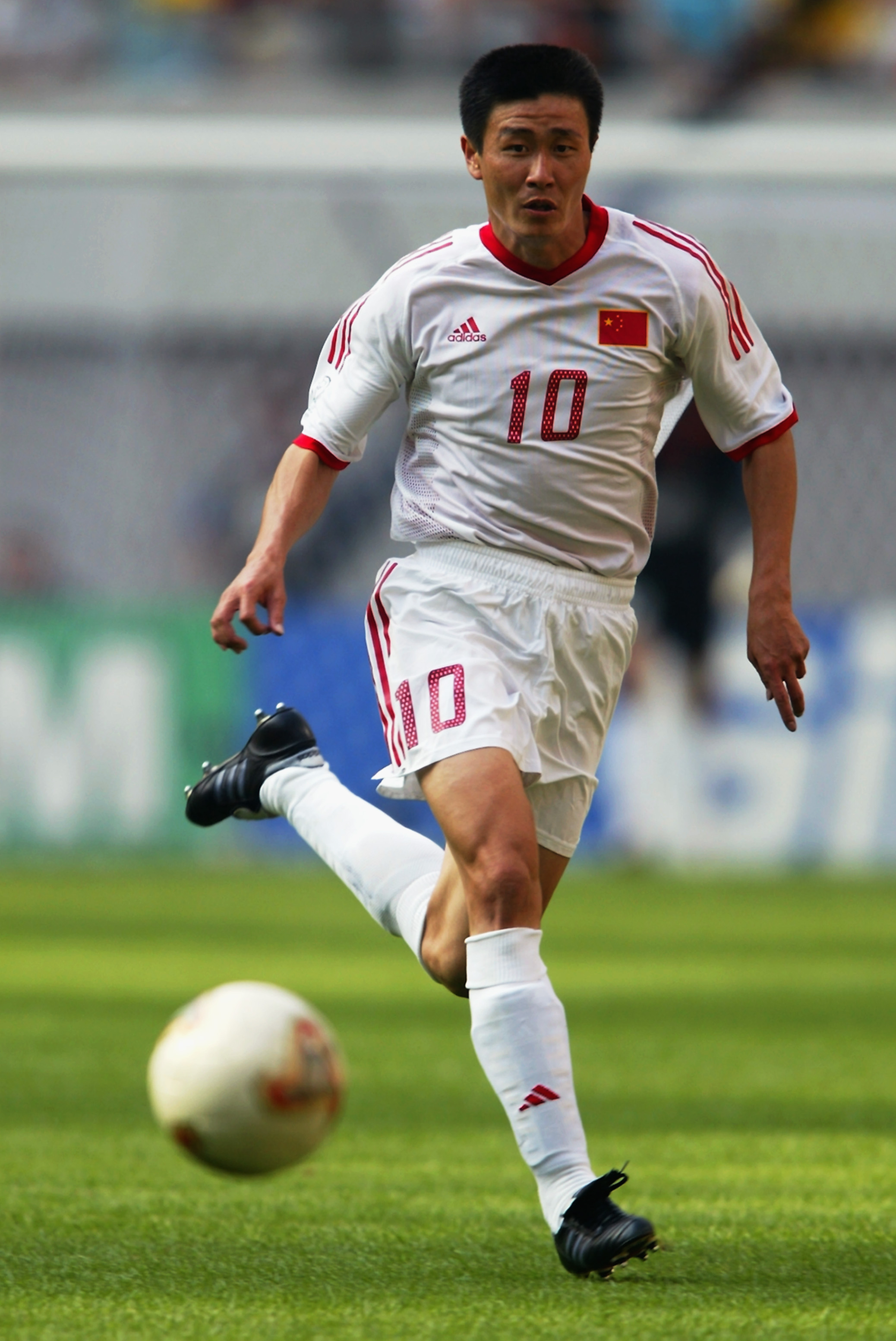 SEOUL - JUNE 13:  Haidong Hao of China runs with the ball during the FIFA World Cup Finals 2002 Group C match between Turkey and China played at the Seoul World Cup Stadium, in Seoul, South Korea on June 13, 2002. Turkey won the match 3-0. DIGITAL IMAGE.