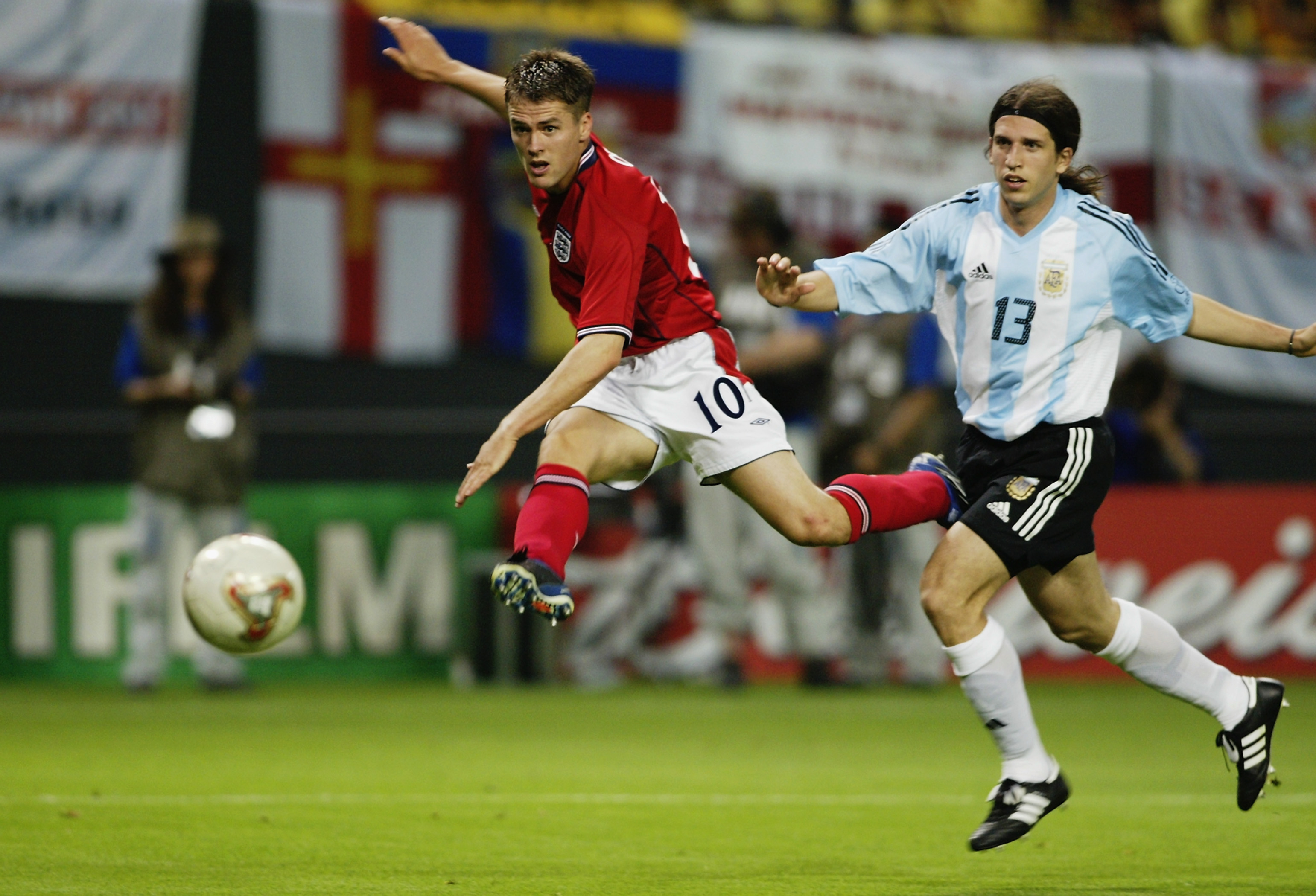 SAPPORO - JUNE 7:  Michael Owen (No.10) of England shoots towards goal while Diego Placente of Argentina looks on during the England v Argentina, Group F, World Cup Group Stage match played at the Sapporo Dome in Sapporo, Japan on June 7, 2002. England wo