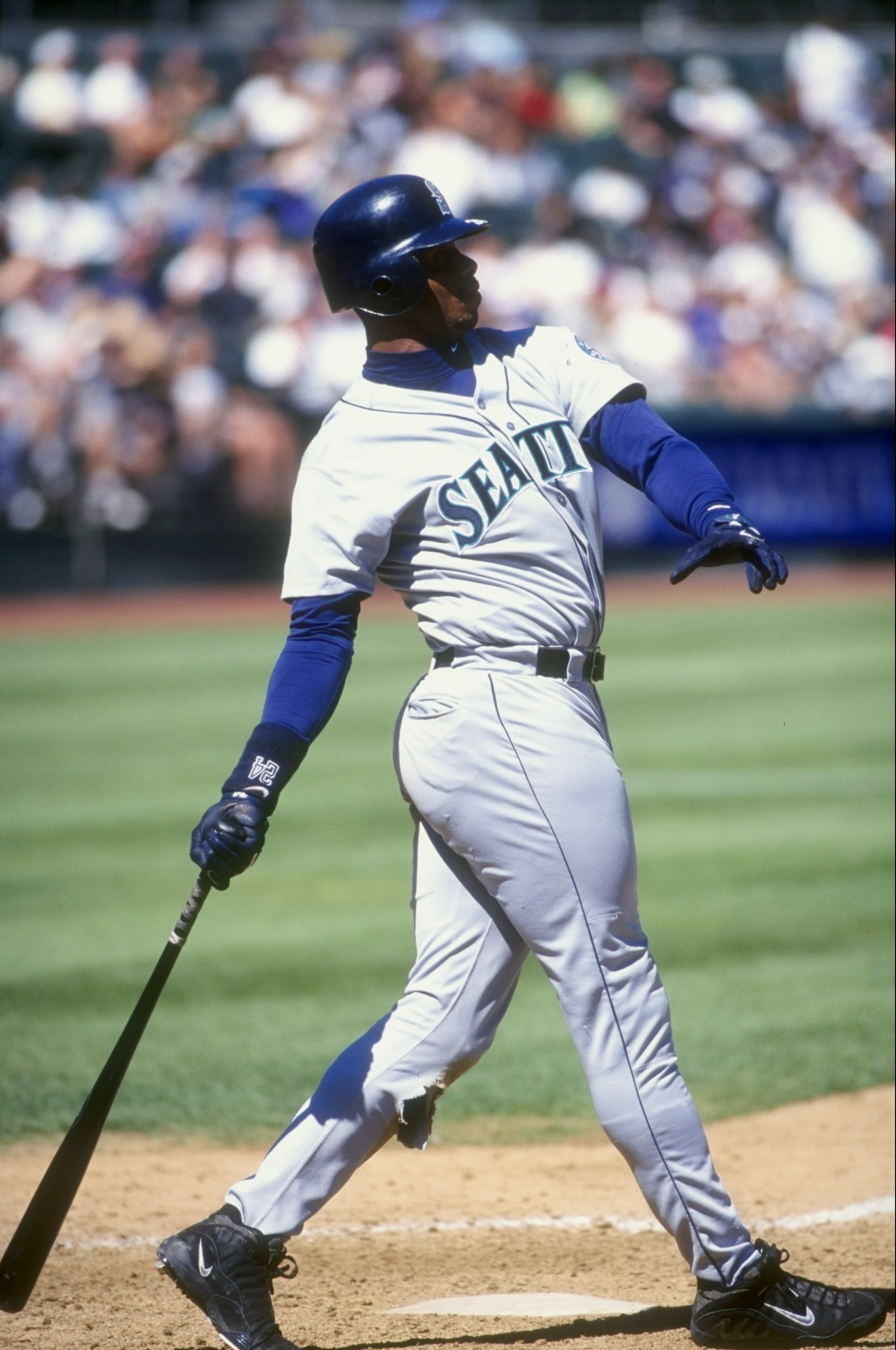 17 Sep 1998: Ken Griffey Jr. #24 of the Seattle Mariners drops his bat as he watches the ball fly during the game agianst the Oakland Athletics at Oakland Coliseum in Oakland, California. The Mariners defeated the A''s 8-0.