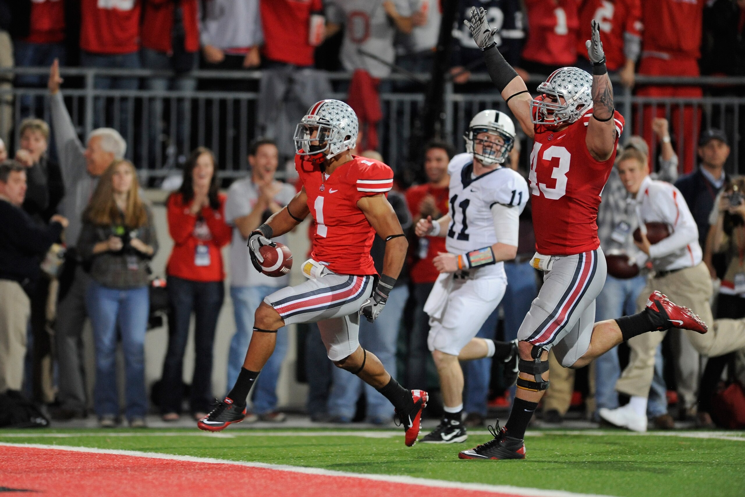COLUMBUS, OH - NOVEMBER 13: Devon Torrence #1 of the Ohio State Buckeyes scores on a 34-yard interception return in the third quarter as quarterback Matt McGloin #11 of the Penn State Nittany Lions pursues and Nathan Williams #43 of the Ohio State Buckey COLUMBUS, OH - NOVEMBER 13: Devon Torrence #1 of the Ohio State Buckeyes scores on a 34-yard interception return in the third quarter as quarterback Matt McGloin #11 of the Penn State Nittany Lions pursues and Nathan Williams #43 of the Ohio State Buckey