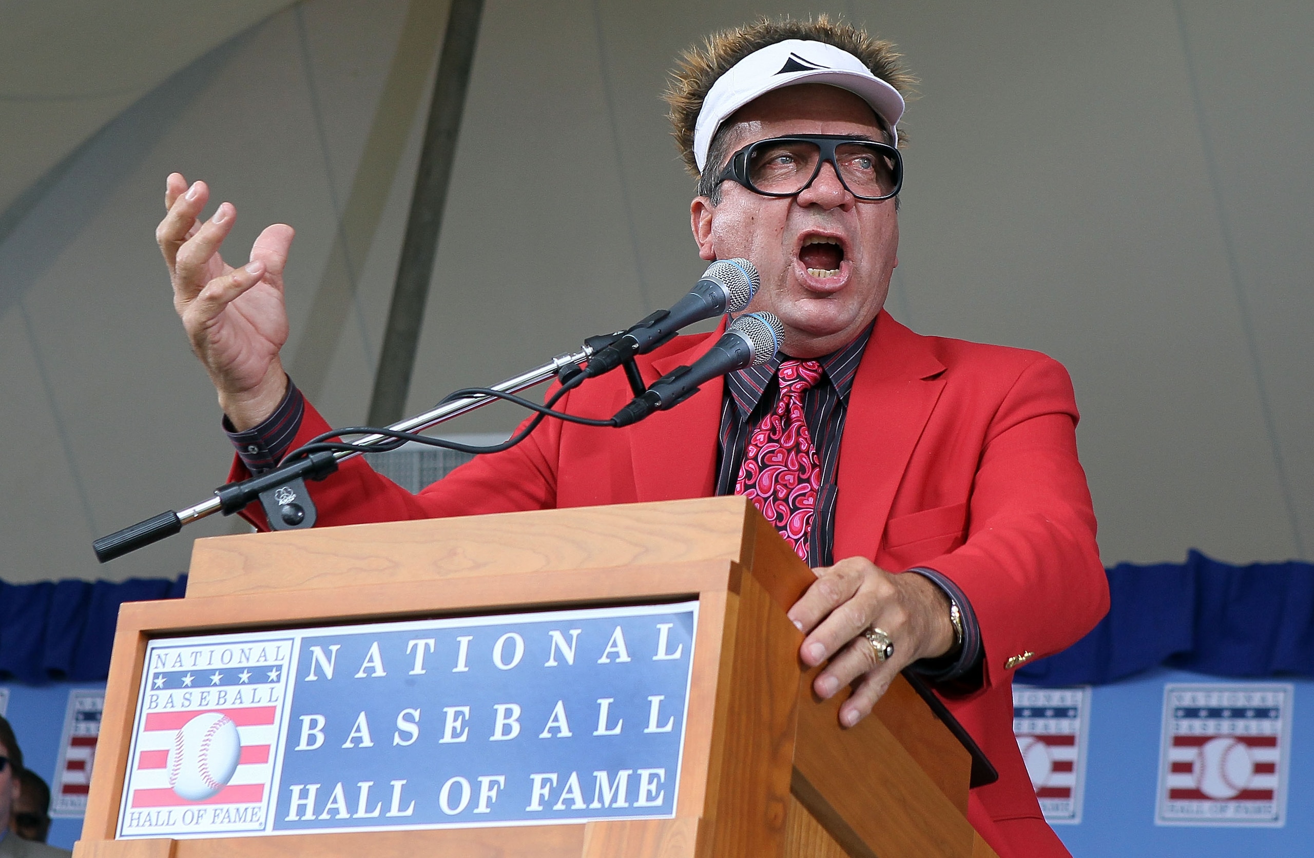 COOPERSTOWN, NY - JULY 25:  Hall of Famer Johnny Bench entertains the crowd at Clark Sports Center during the Baseball Hall of Fame induction ceremony on July 25, 20010 in Cooperstown, New York. (Photo by Jim McIsaac/Getty Images)