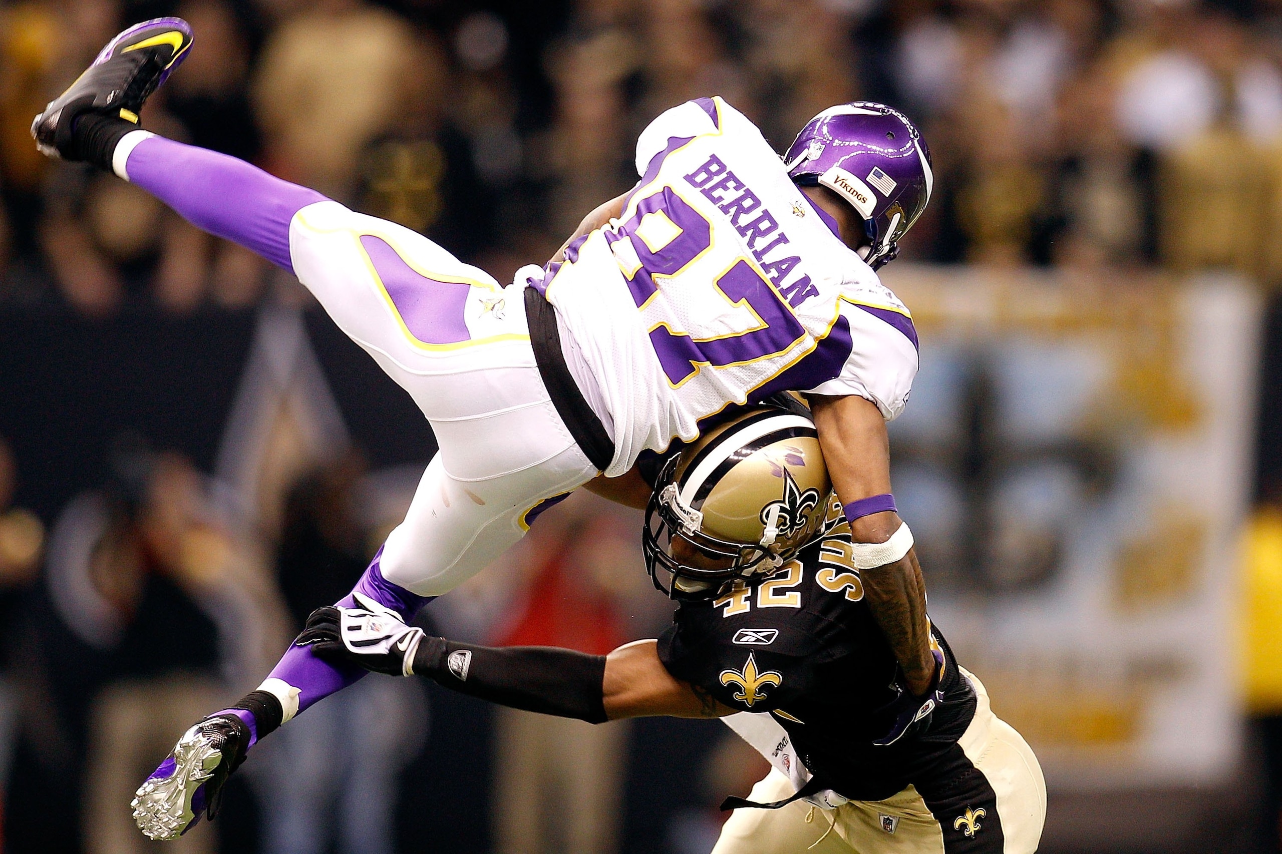 NEW ORLEANS - JANUARY 24:  Darren Sharper #42 of the New Orleans Saints hits Bernard Berrian #87 of the Minnesota Vikings during the NFC Championship Game at the Louisiana Superdome on January 24, 2010 in New Orleans, Louisiana. The Saints won 31-28. (Pho