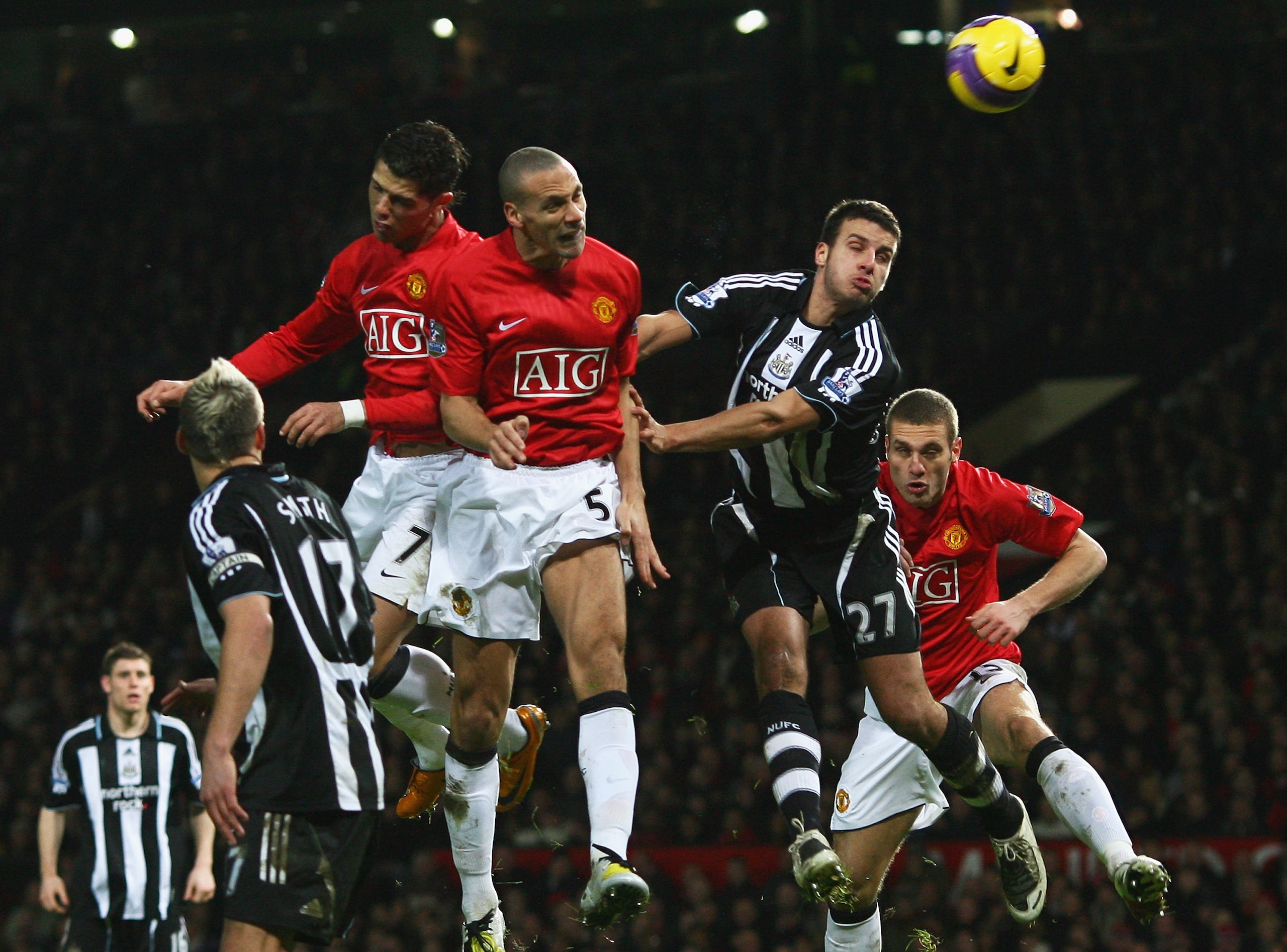 MANCHESTER, UNITED KINGDOM - JANUARY 12: Cristiano Ronaldo #7, Rio Ferdinand #5 and Nemanja Vidic (R) of Manchester battle for a header with Steven Taylor #27 of Newcastle during the Barclays Premier League match between Manchester United and Newcastle U MANCHESTER, UNITED KINGDOM - JANUARY 12: Cristiano Ronaldo #7, Rio Ferdinand #5 and Nemanja Vidic (R) of Manchester battle for a header with Steven Taylor #27 of Newcastle during the Barclays Premier League match between Manchester United and Newcastle U