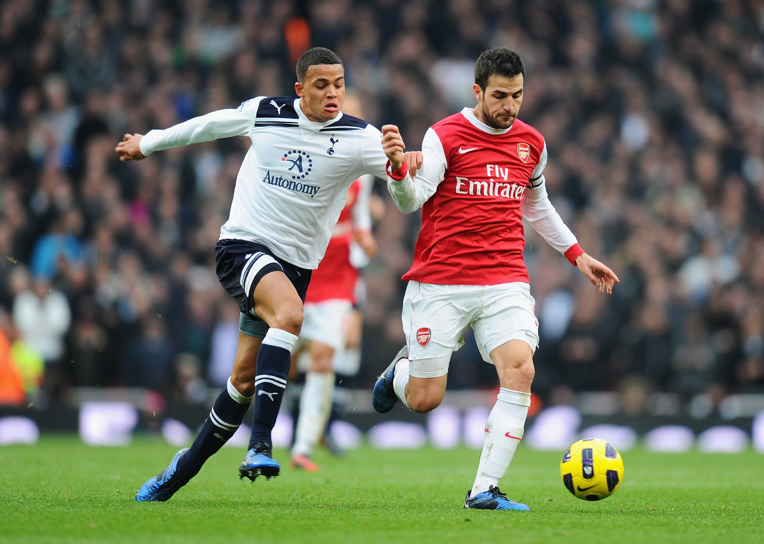 LONDON, ENGLAND - NOVEMBER 20: Jermaine Jenas of Tottenham challenges Cesc Fabregas of Arsenal during the Barclays Premier League match between Arsenal and Tottenham Hotspur at the Emirates Stadium on November 20, 2010 in London, England. (Photo by Mike LONDON, ENGLAND - NOVEMBER 20: Jermaine Jenas of Tottenham challenges Cesc Fabregas of Arsenal during the Barclays Premier League match between Arsenal and Tottenham Hotspur at the Emirates Stadium on November 20, 2010 in London, England. (Photo by Mike
