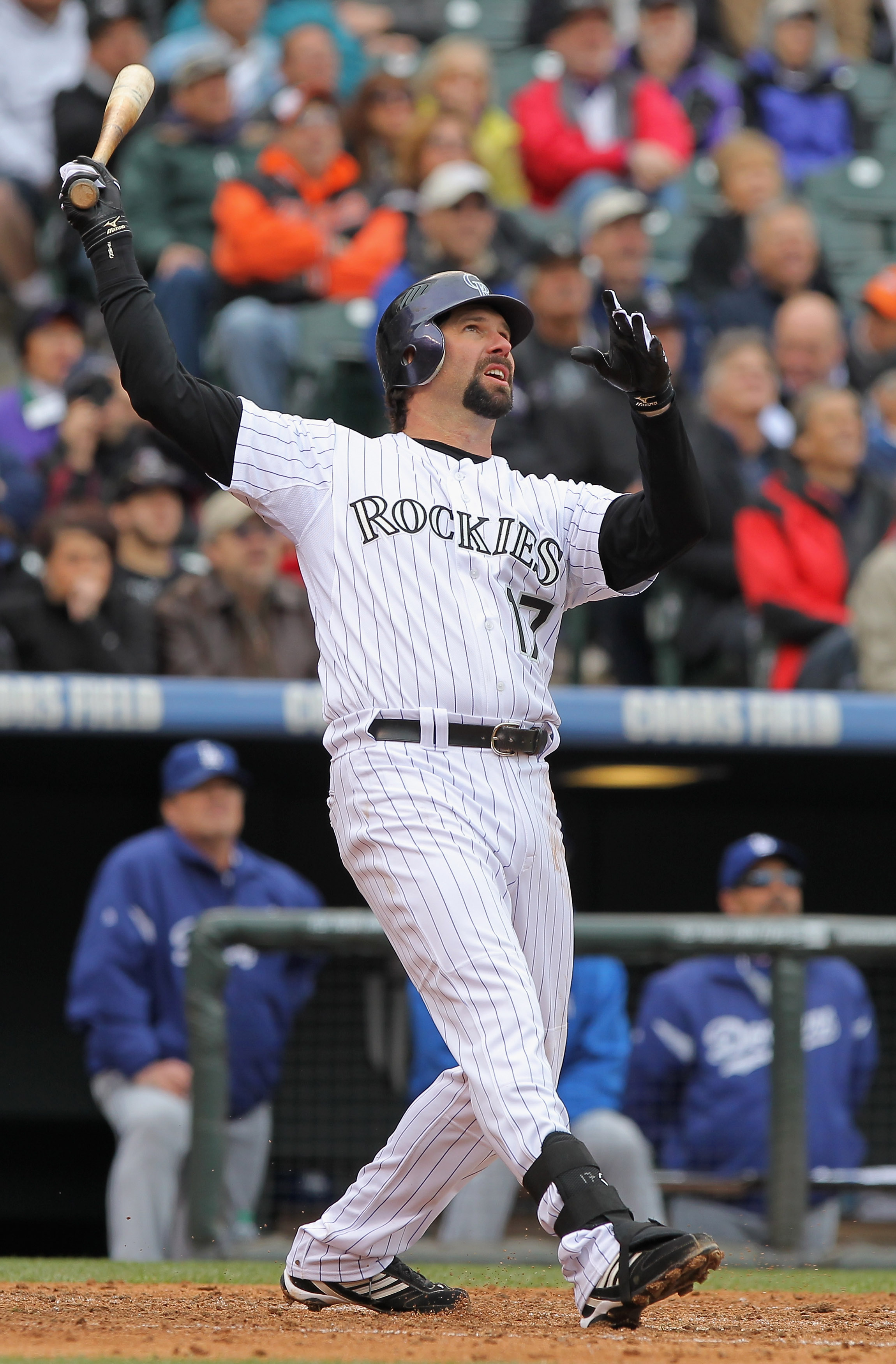 DENVER, CO - APRIL 06:  First baseman Todd Helton #17 of the Colorado Rockies watches his three run homerun off of starting pitcher Chad Billingsley #58 of the Los Angeles Dodgers to give the Rockies a 5-4 lead in the third inning at Coors Field on April