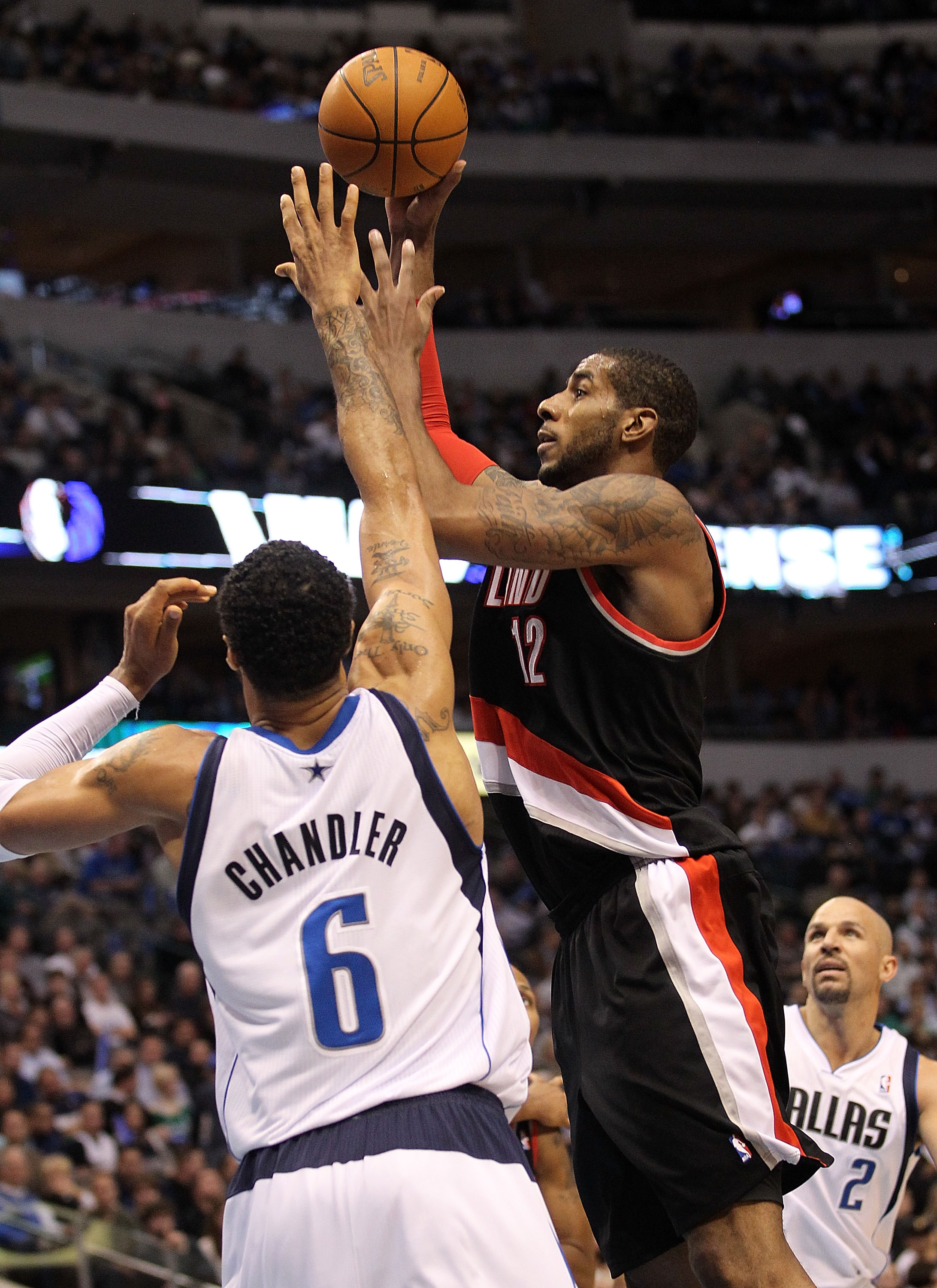 DALLAS, TX - JANUARY 04:  Forward LaMarcus Aldridge #12 of the Portland Trail Blazers takes a shot against Tyson Chandler #6 of the Dallas Mavericks at American Airlines Center on January 4, 2011 in Dallas, Texas.  NOTE TO USER: User expressly acknowledge