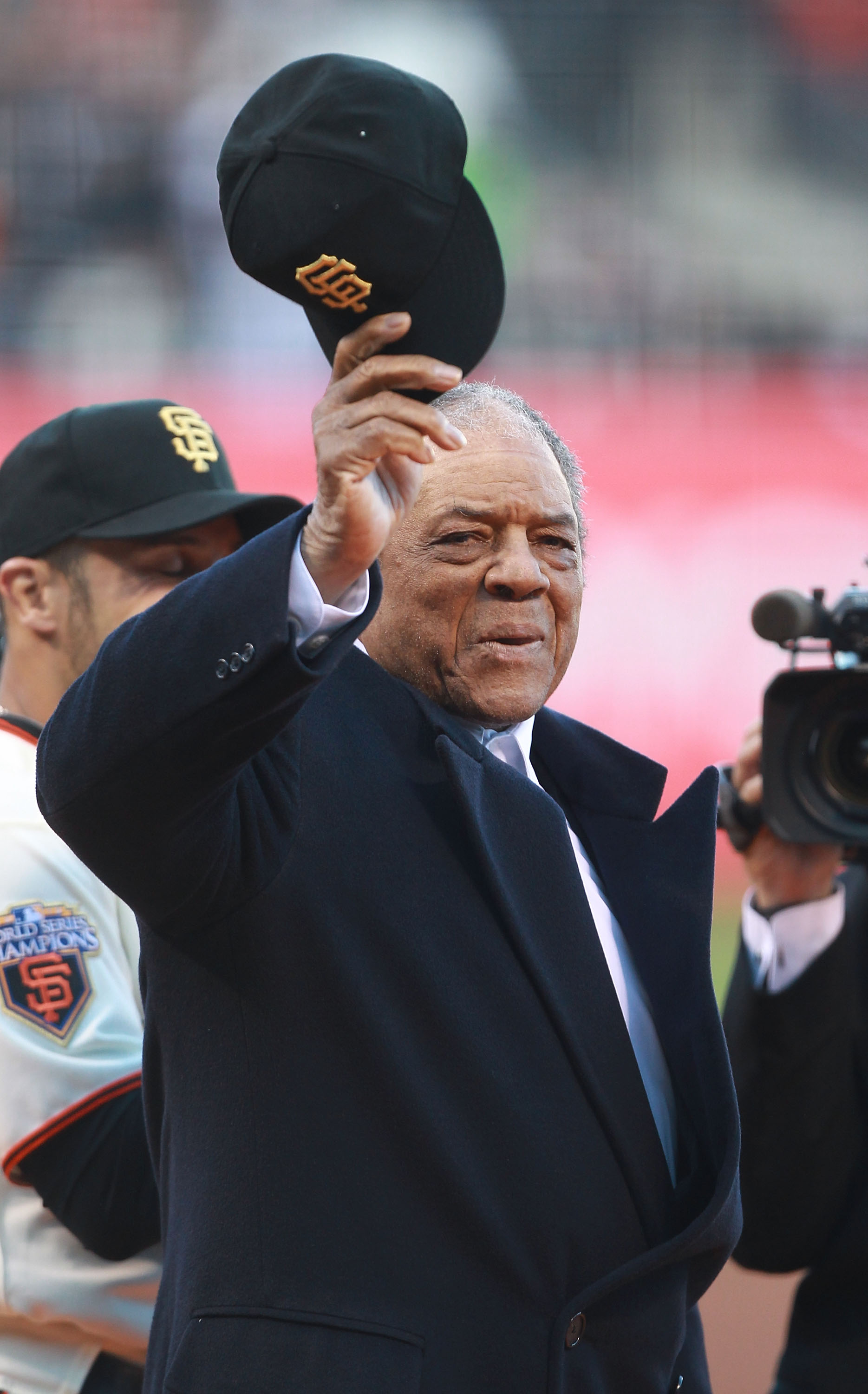 SAN FRANCISCO, CA - APRIL 09:  Former Gmember of the San Francisco Giants Willie Mays waves to the crowd before recieving his World Series against the St. Louis Cardinals  at AT&T Park on April 9, 2011 in San Francisco, California.  (Photo by Jed Jacobsoh