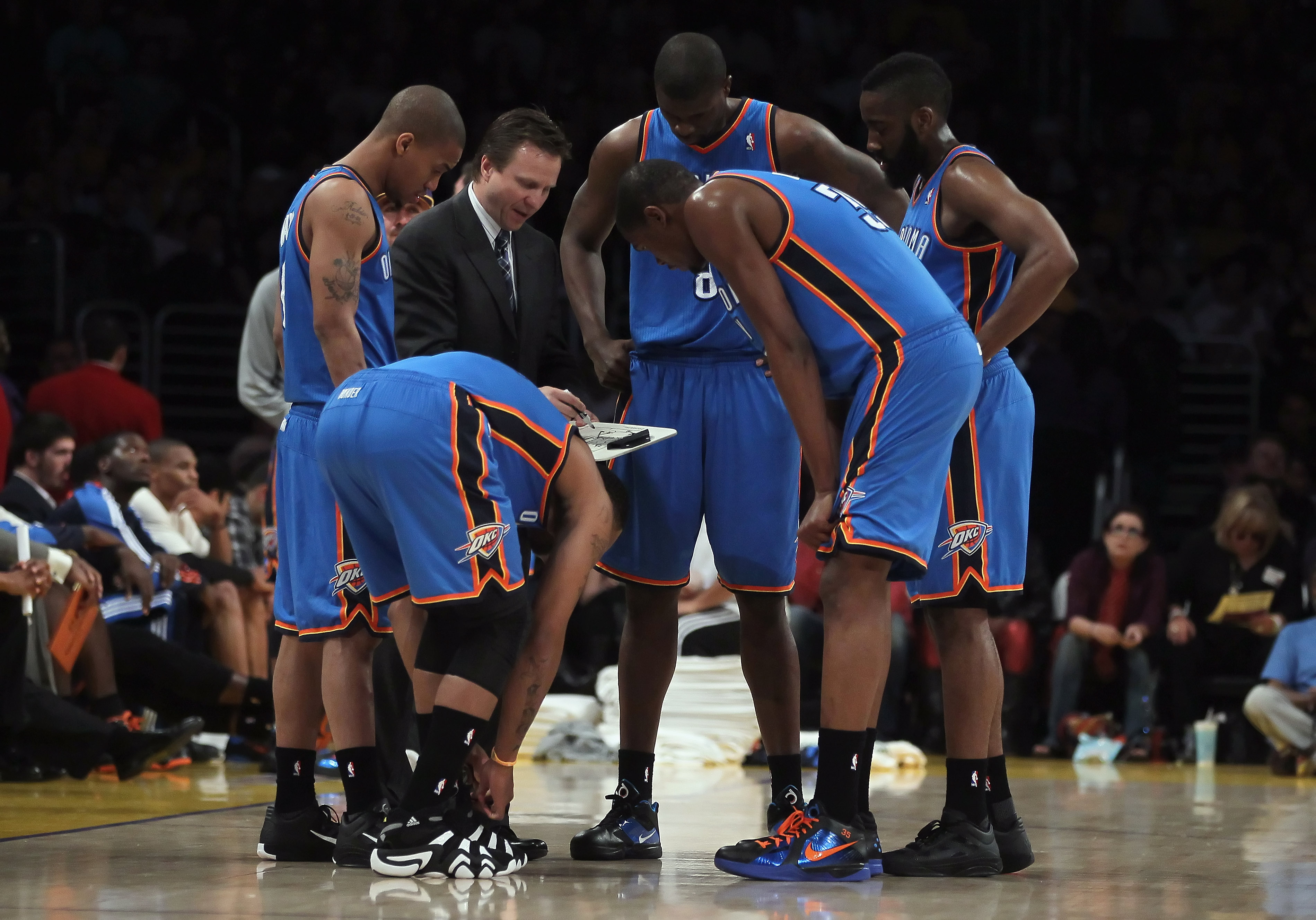LOS ANGELES, CA - APRIL 10:  Oklahoma City Thunder head coach Scott Brooks draws up a play for his team during a timeout in the first half against the Los Angeles Lakers at Staples Center on April 10, 2011 in Los Angeles, California. The Thunder defeated