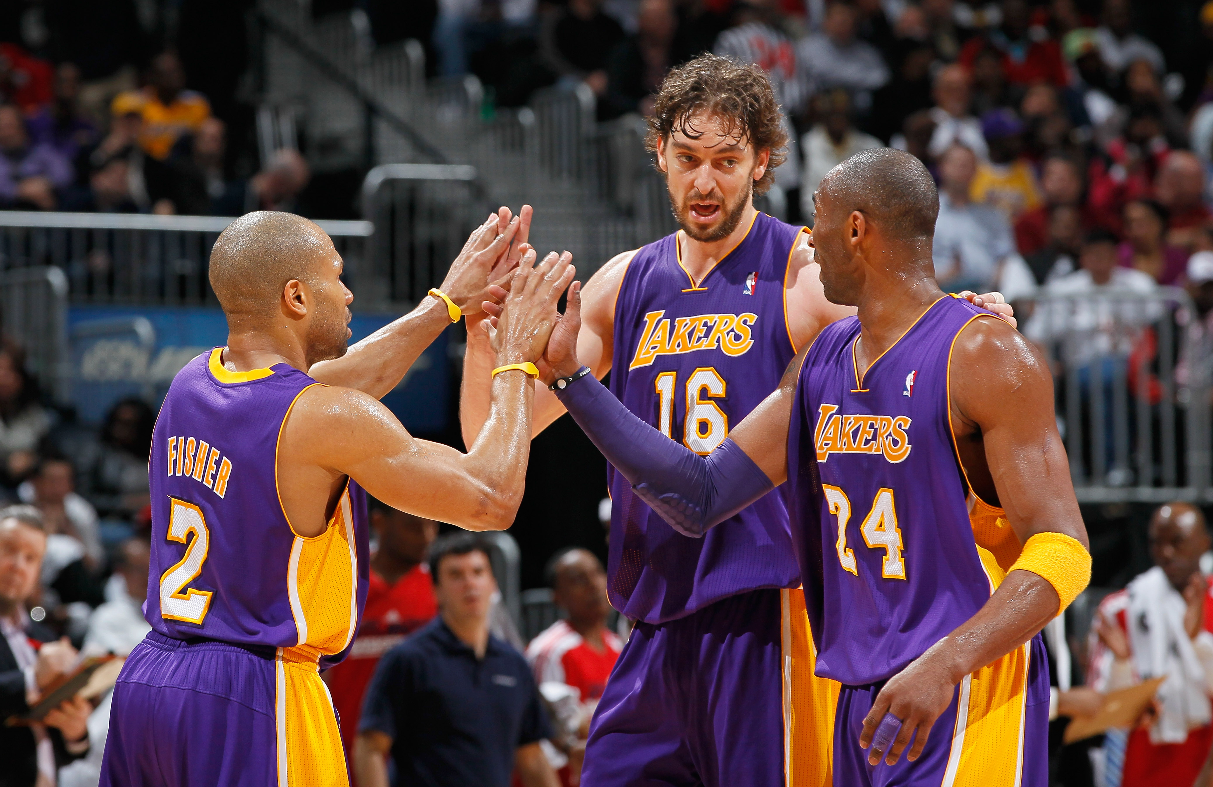 ATLANTA, GA - MARCH 08:  Derek Fisher #2, Pau Gasol #16 and Kobe Bryant #24 of the Los Angeles Lakers react after a timeout during the game against the Atlanta Hawks at Philips Arena on March 8, 2011 in Atlanta, Georgia.  NOTE TO USER: User expressly ackn