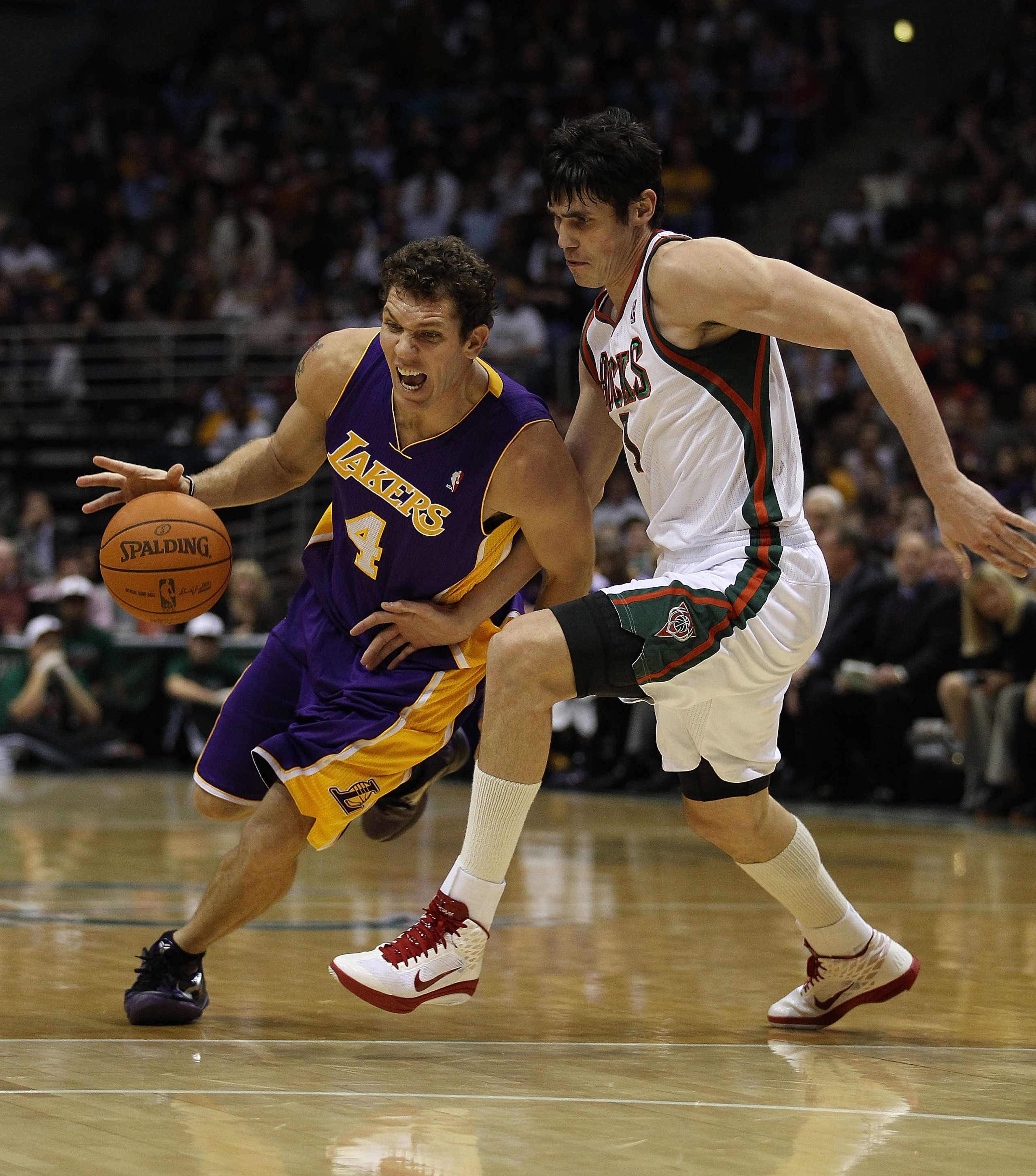 MILWAUKEE - NOVEMBER 16: Luke Walton #4 of the Los Angeles Lakers moves around Ersan Ilyasova #7 of the Milwaukee Bucks at the Bradley Center on November 16, 2010 in Milwaukee, Wisconsin. The Lakers defeated the Bucks 118-107. NOTE TO USER: User expressly