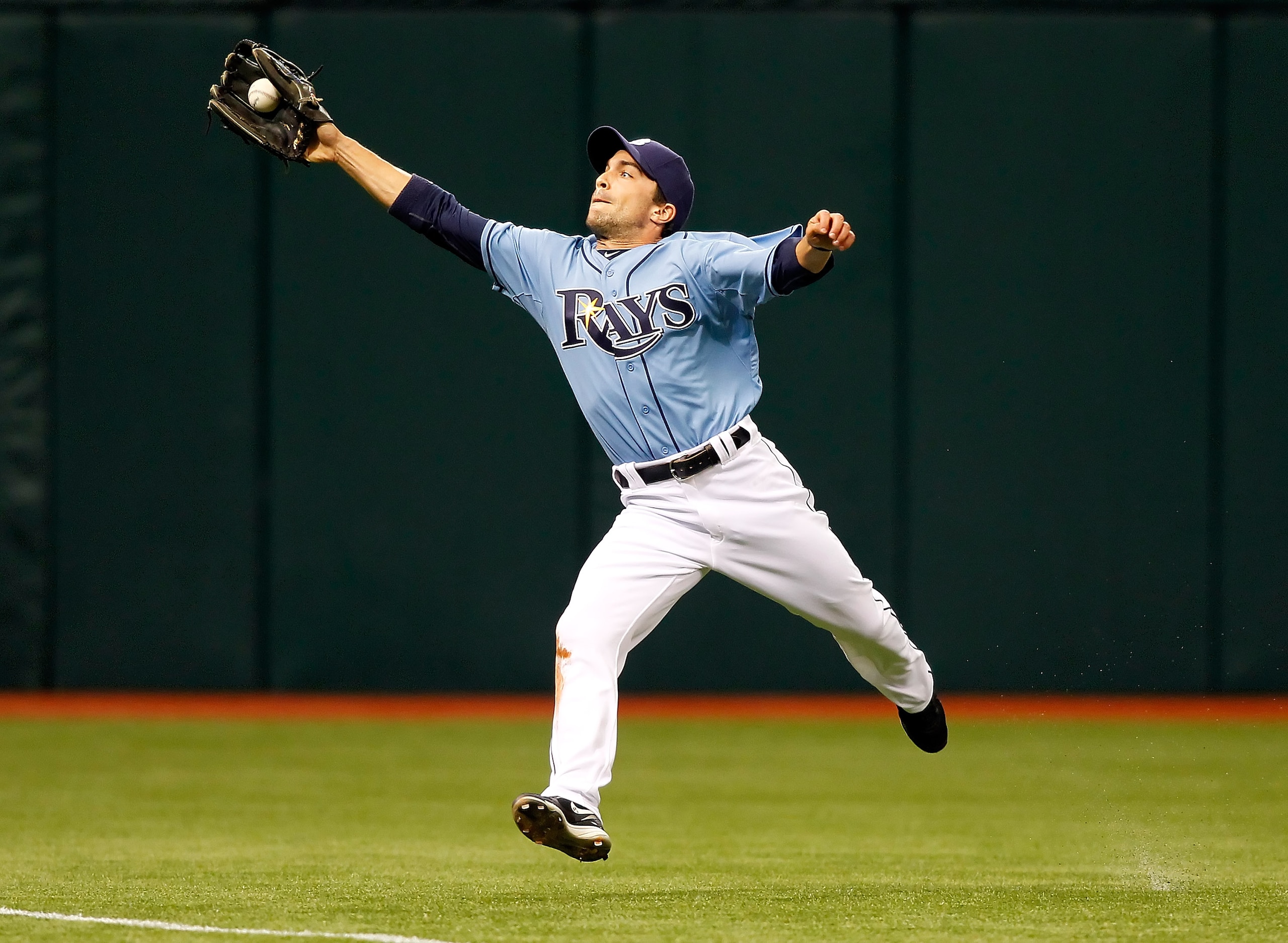 ST. PETERSBURG, FL - APRIL 03:  Outfielder Sam Fuld #5 of the Tampa Bay Rays catches a ball against the Baltimore Orioles during the game at Tropicana Field on April 3, 2011 in St. Petersburg, Florida.  (Photo by J. Meric/Getty Images)