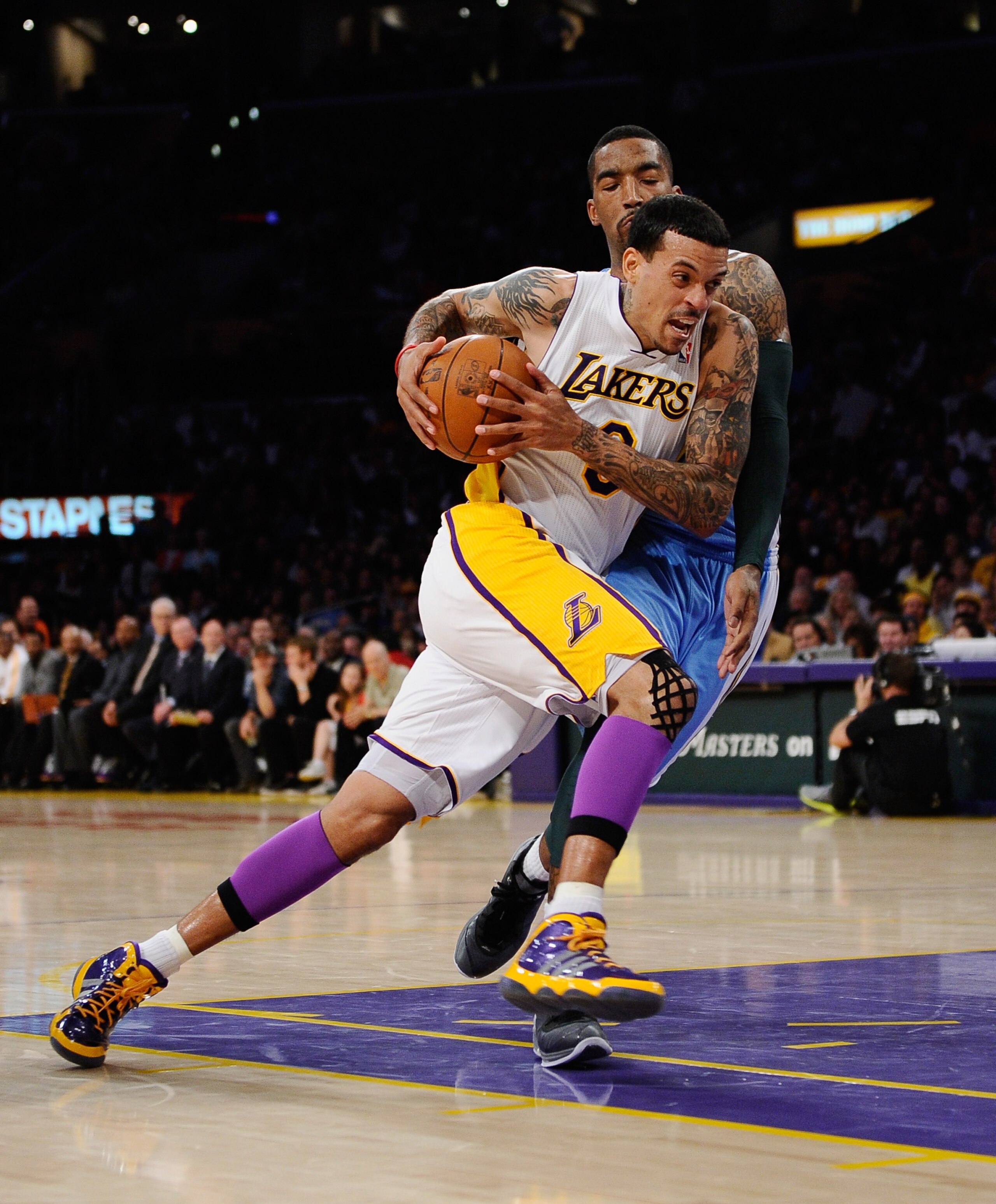 LOS ANGELES, CA - APRIL 03:  Matt Barnes #9 of the Los Angeles Lakers drives against JR Smith #5 of the Denver Nuggets at Staples Center on April 3, 2011 in Los Angeles, California. NOTE TO USER: User expressly acknowledges and agrees that, by downloading