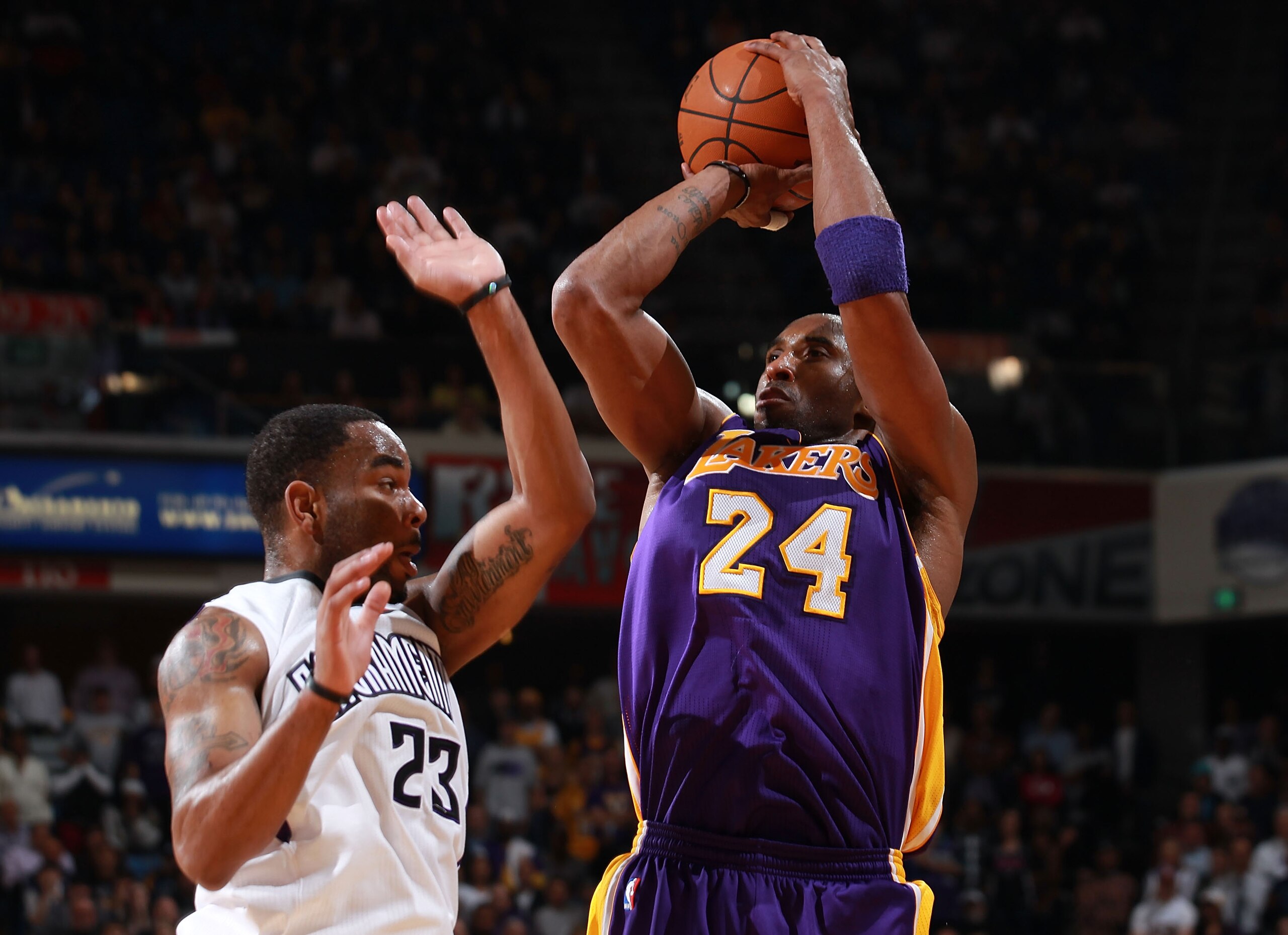 SACRAMENTO, CA - APRIL 13:  Kobe Bryant #24 of the Los Angeles Lakers shoots against Marcus Thornton #23 of the Sacramento Kings look on against  on April 13, 2011 at Power Balence Pavilion in Sacramento, California. NOTE TO USER: User expressly acknowled