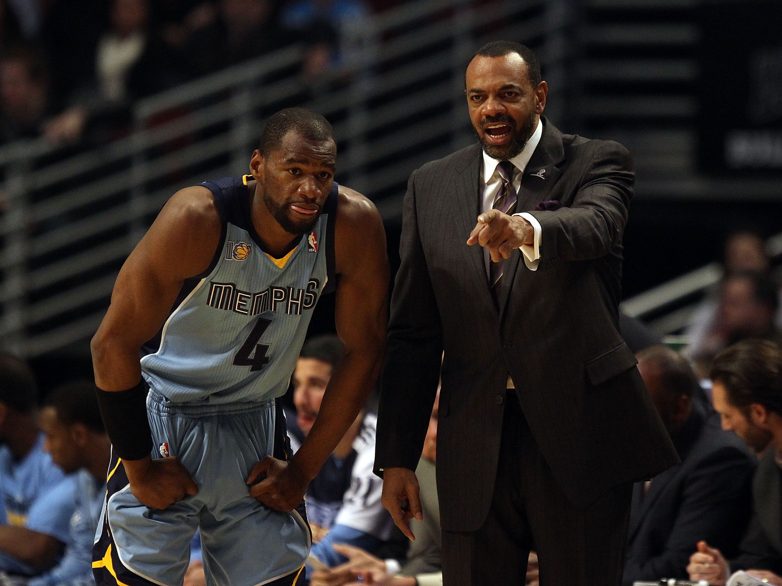 CHICAGO, IL - MARCH 25: Head coach Lionel Hollins  of the Memphis Grizzlies gives instructions to Sam Young #4 during a game against the Chicago Bulls at the United Center on March 25, 2011 in Chicago, Illinois. The Bulls defeated the Grizzlies 99-96. NOT