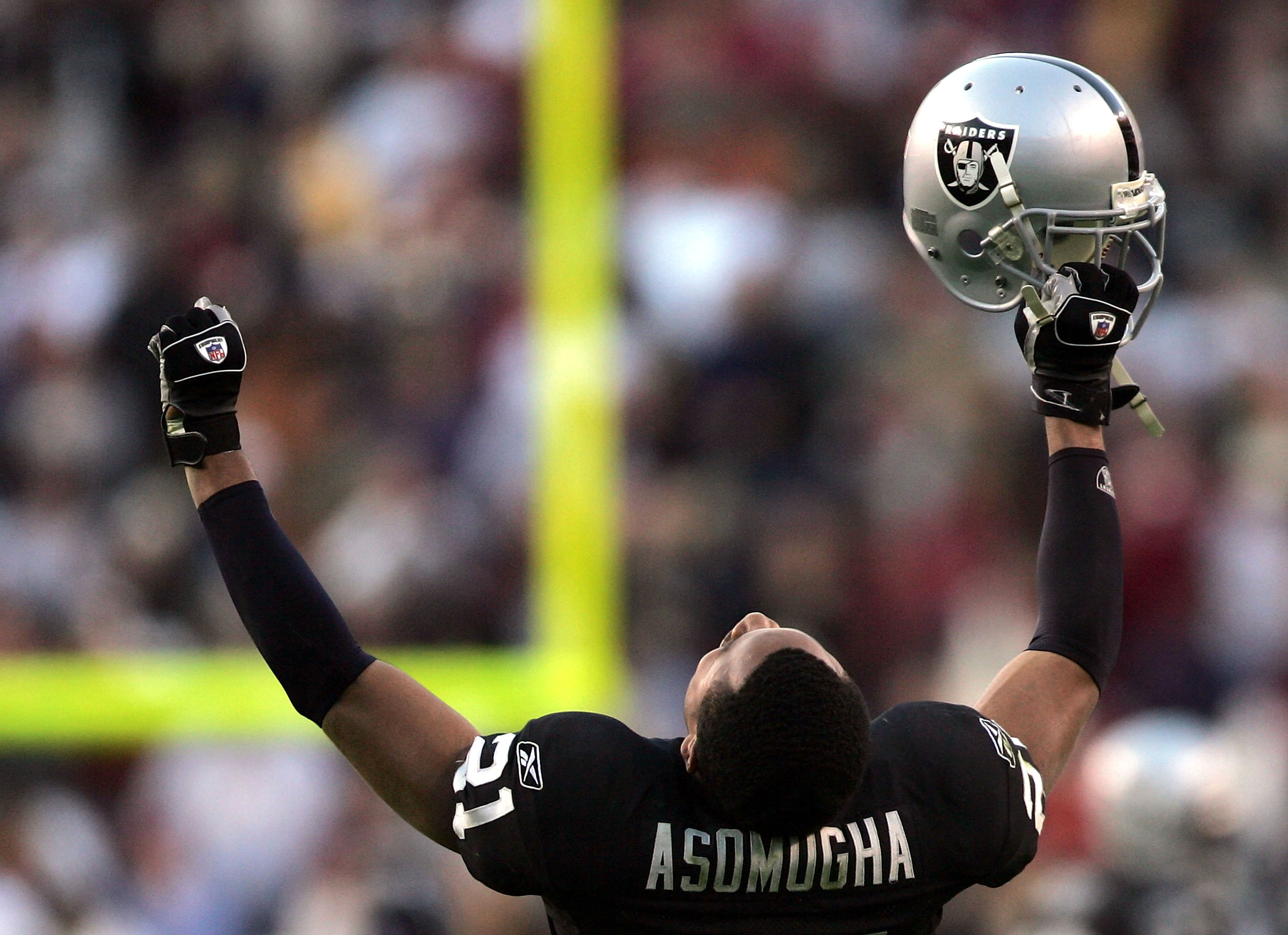 WASHINGTON - NOVEMBER 20:  Oakland Raiders cornerback Nnamdi Asomugha #21 celebrates after the Raiders recovered a game winning fumble in the fourth quarter on November 20, 2005 at Fed Ex Field in Landover, Maryland.  (Photo by Win McNamee/Getty Images)