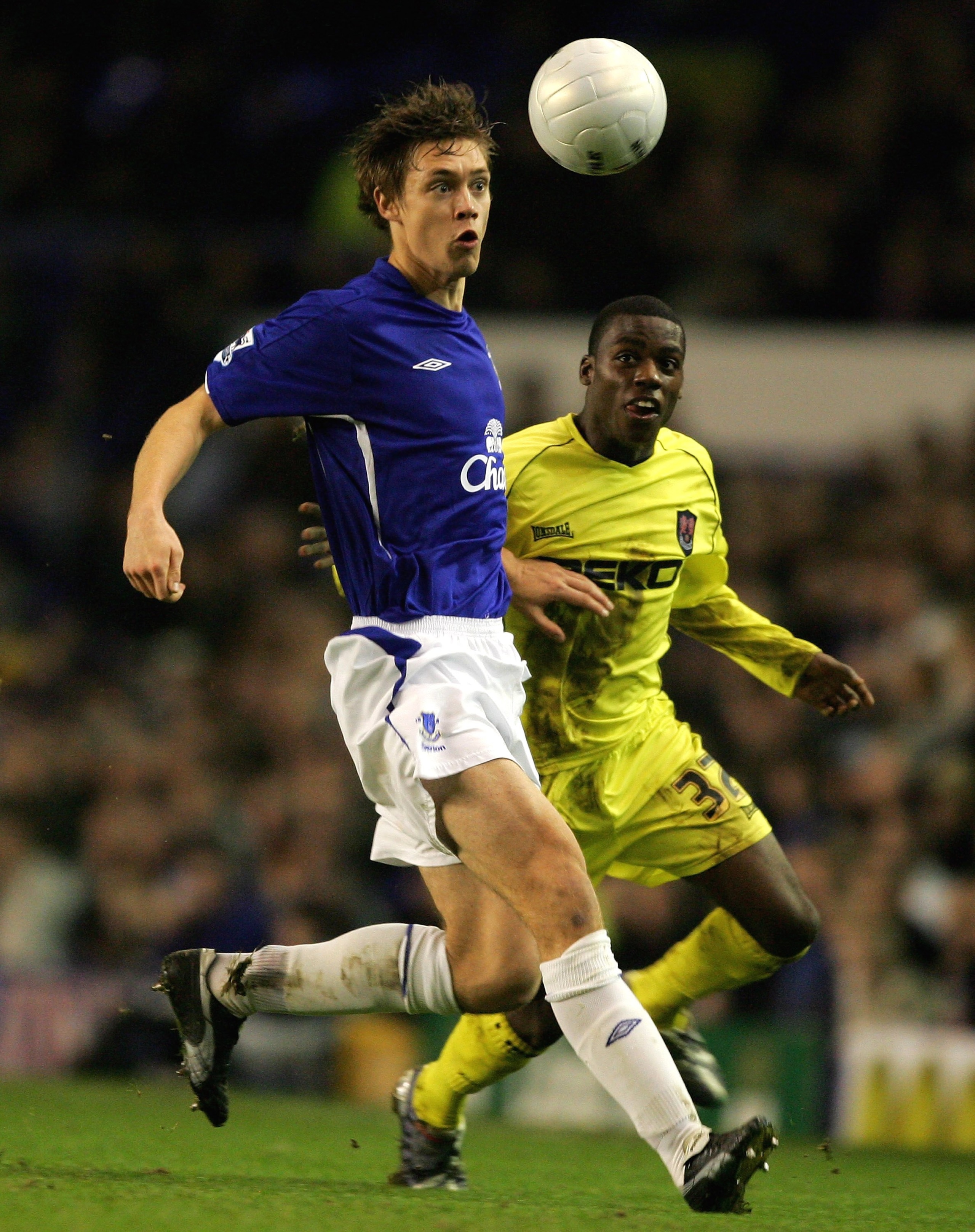 LIVERPOOL, UNITED KINGDOM - JANUARY 18:  Per Kroldrup of Everton is challenged by Marvin Williams of Millwall during the FA Cup Third Round Replay match between Everton and Millwall at Goodison Park on January 18, 2006 in Liverpool, England.  (Photo by Cl