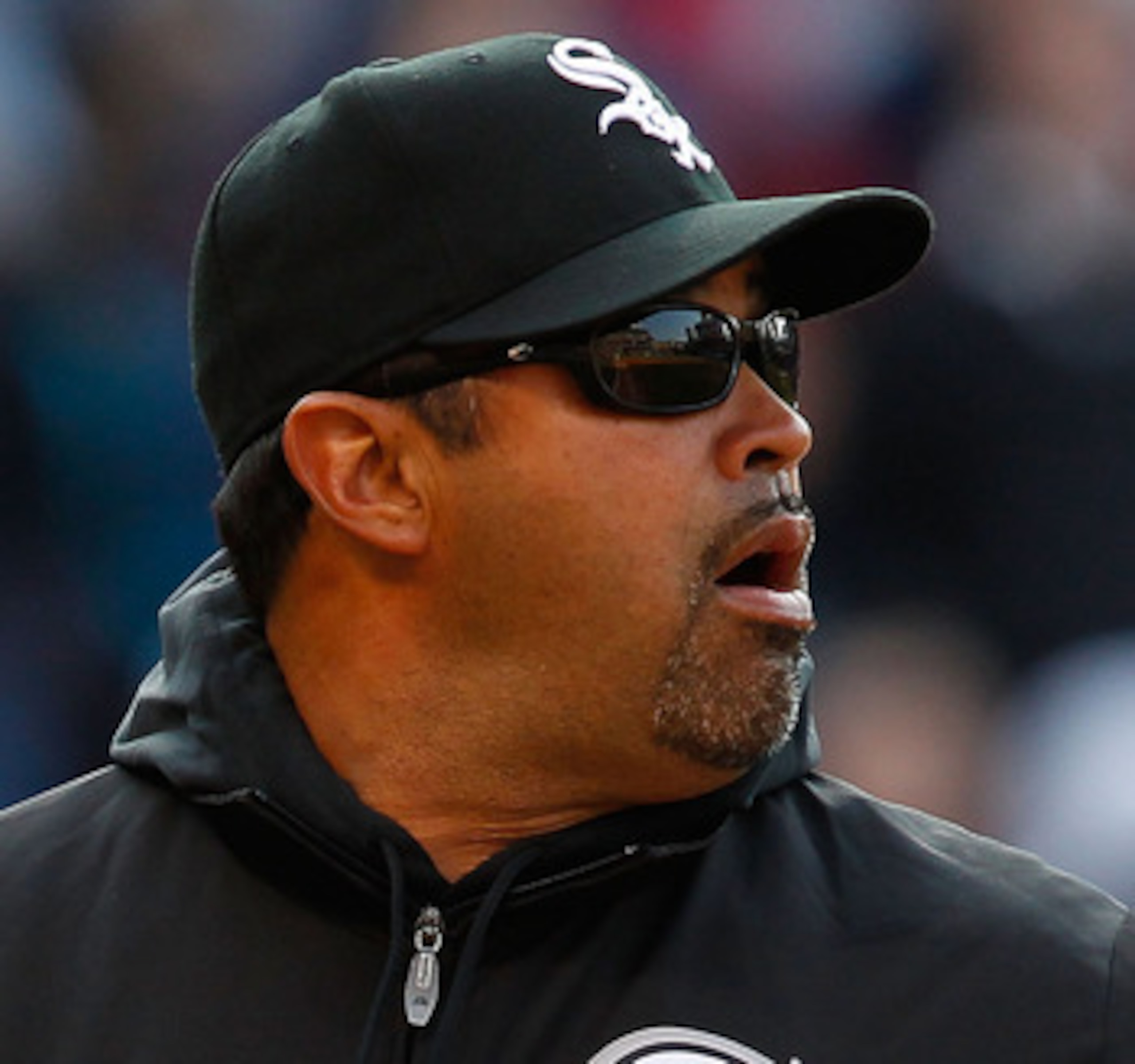 CLEVELAND - APRIL 01:  Manager Ozzie Guillen #13 of the Chicago White Sox walks to the dugout during the Opening Day game against the Cleveland Indians on April 1, 2011 at Progressive Field in Cleveland, Ohio.  (Photo by Jared Wickerham/Getty Images)