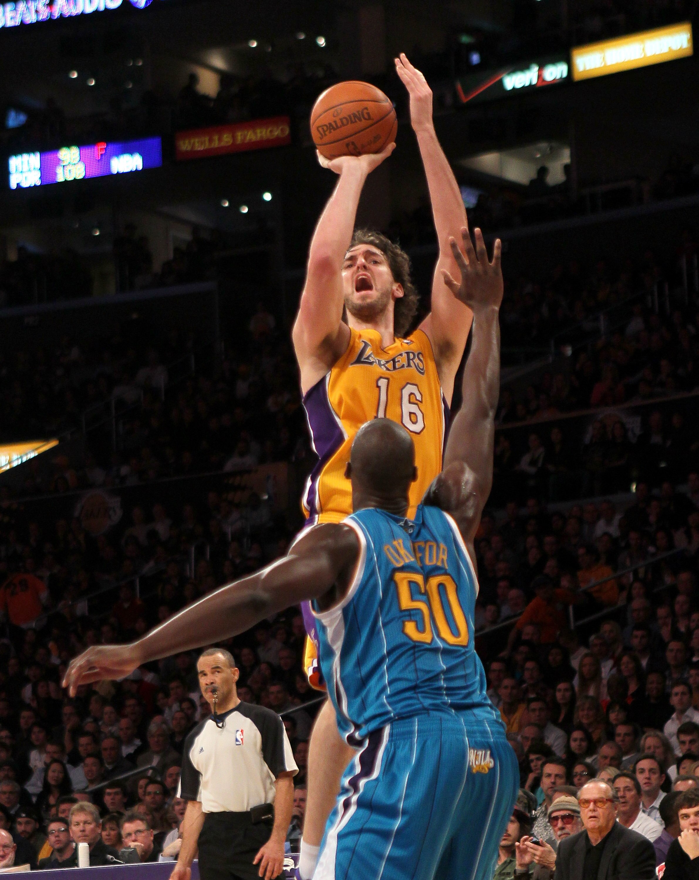 LOS ANGELES, CA - JANUARY 7:   Pau Gasol #16 of the Los Angeles Lakers shoots over Emeka Okafor #50 of the New Orleans Hornets at Staples Center on January 7, 2011 in Los Angeles, California.  The Lakers won 101-97.  NOTE TO USER: User expressly acknowled