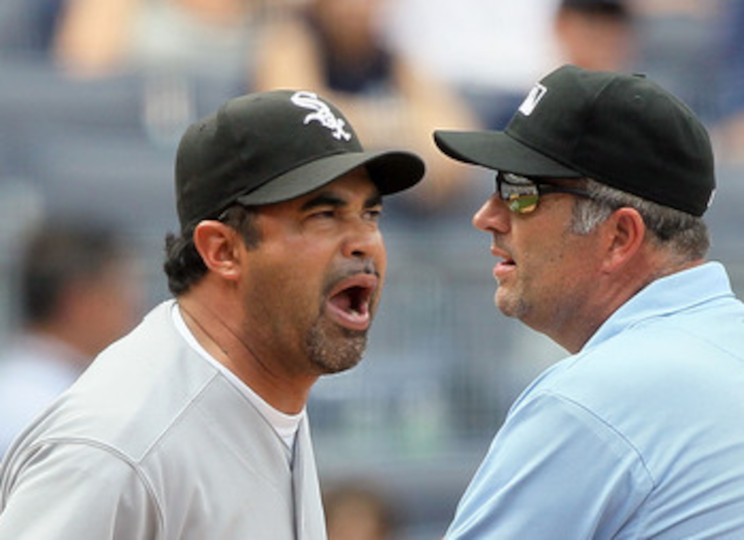 NEW YORK - MAY 02:  Manager Ozzie Guillen of the Chicago White Sox gets in a few last words with first base umpire Dale Scott after being ejected from the game against the New York Yankees by home plate umpire Dan Iassogna (not pictured) on May 2, 2010 at