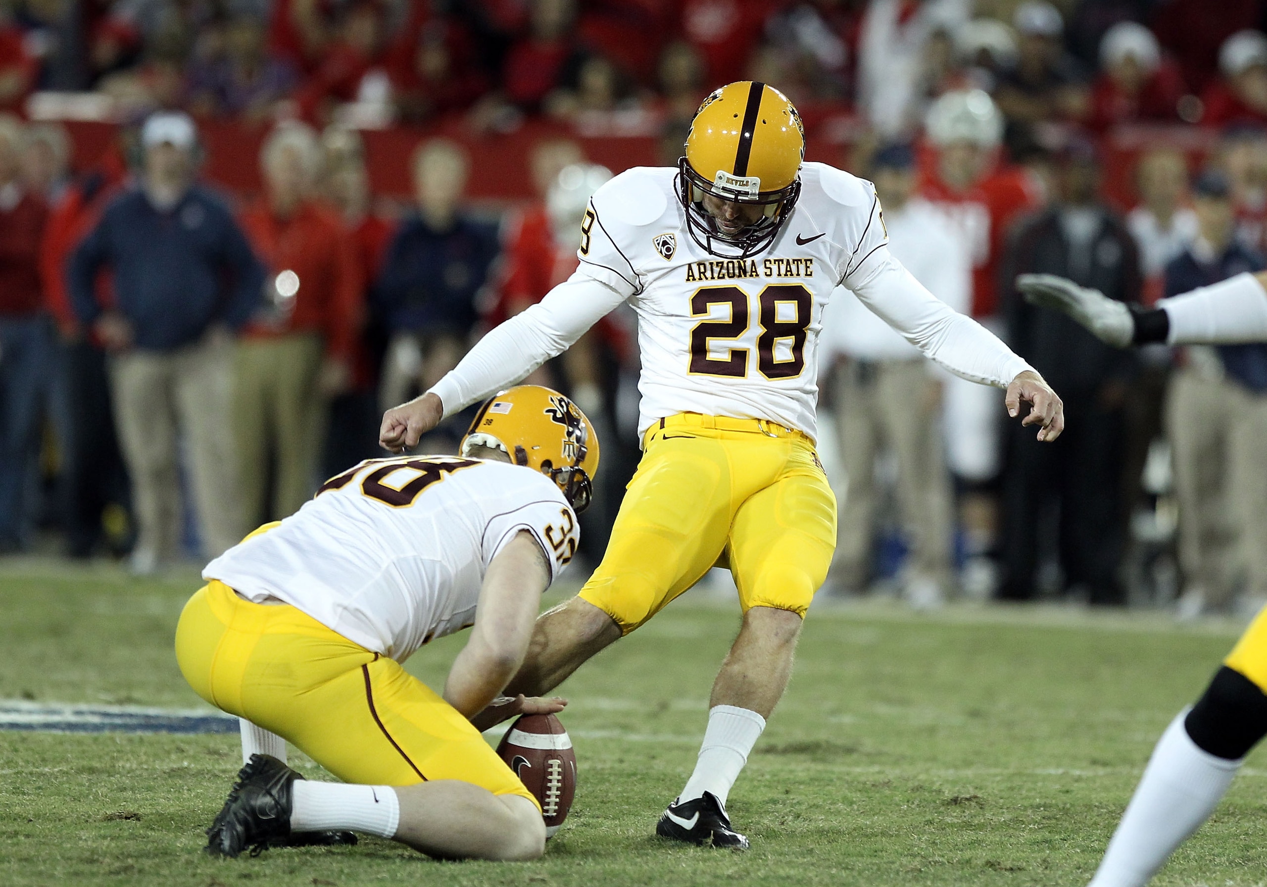 TUCSON, AZ - DECEMBER 02:  Kicker Thomas Weber #28 of the Arizona State Sun Devils kicks a field goal during the college football game at Arizona Stadium on December 2, 2010 in Tucson, Arizona. The Sun Devils defeated the Wildcats 30-29 in double overtime