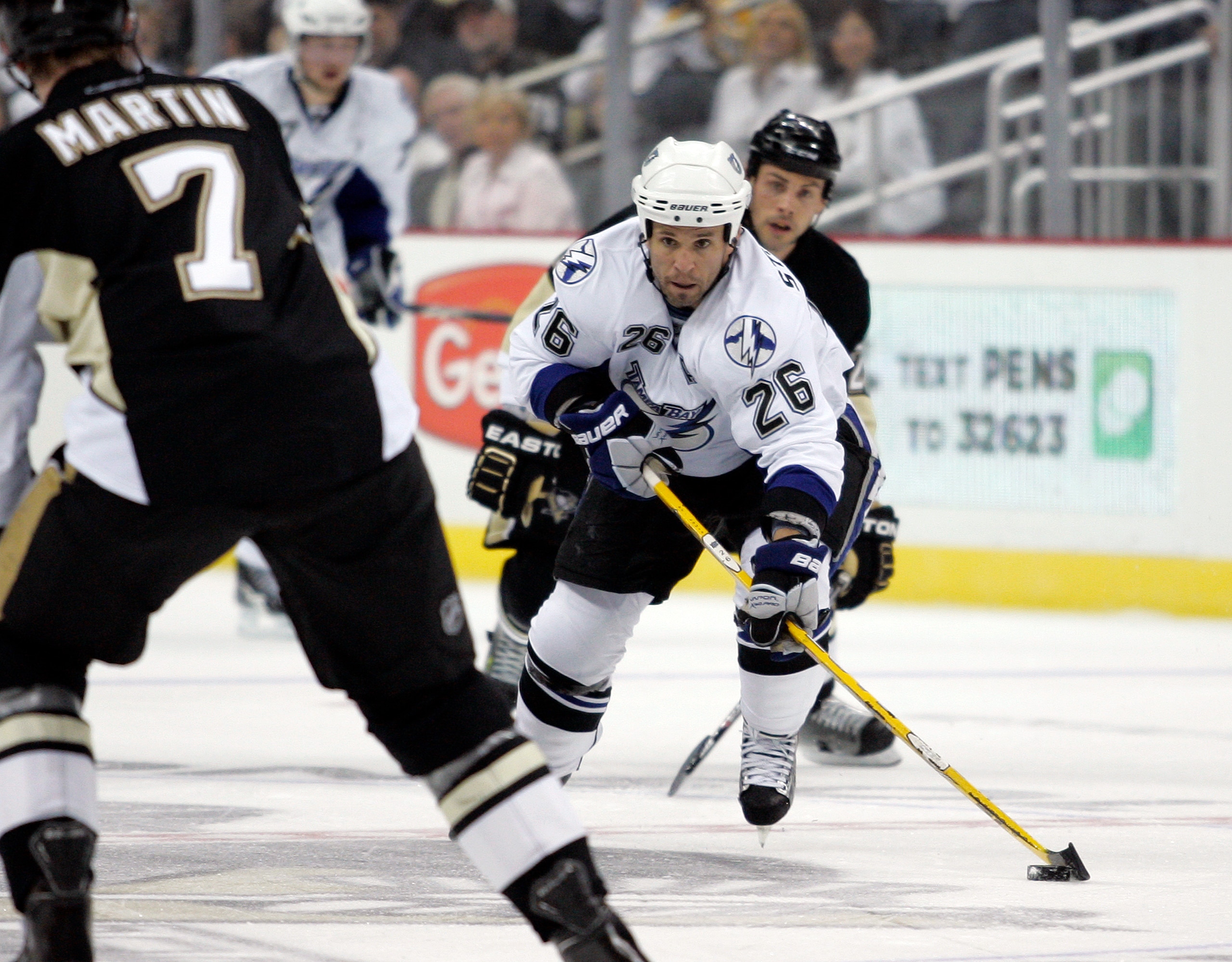 PITTSBURGH, PA - APRIL 13:  Martin St. Louis #26 of the Tampa Bay Lightning handles the puck against the Pittsburgh Penguins in Game One of the Eastern Conference Quarterfinals during the 2011 NHL Stanley Cup Playoffs at Consol Energy Center on April 13, 
